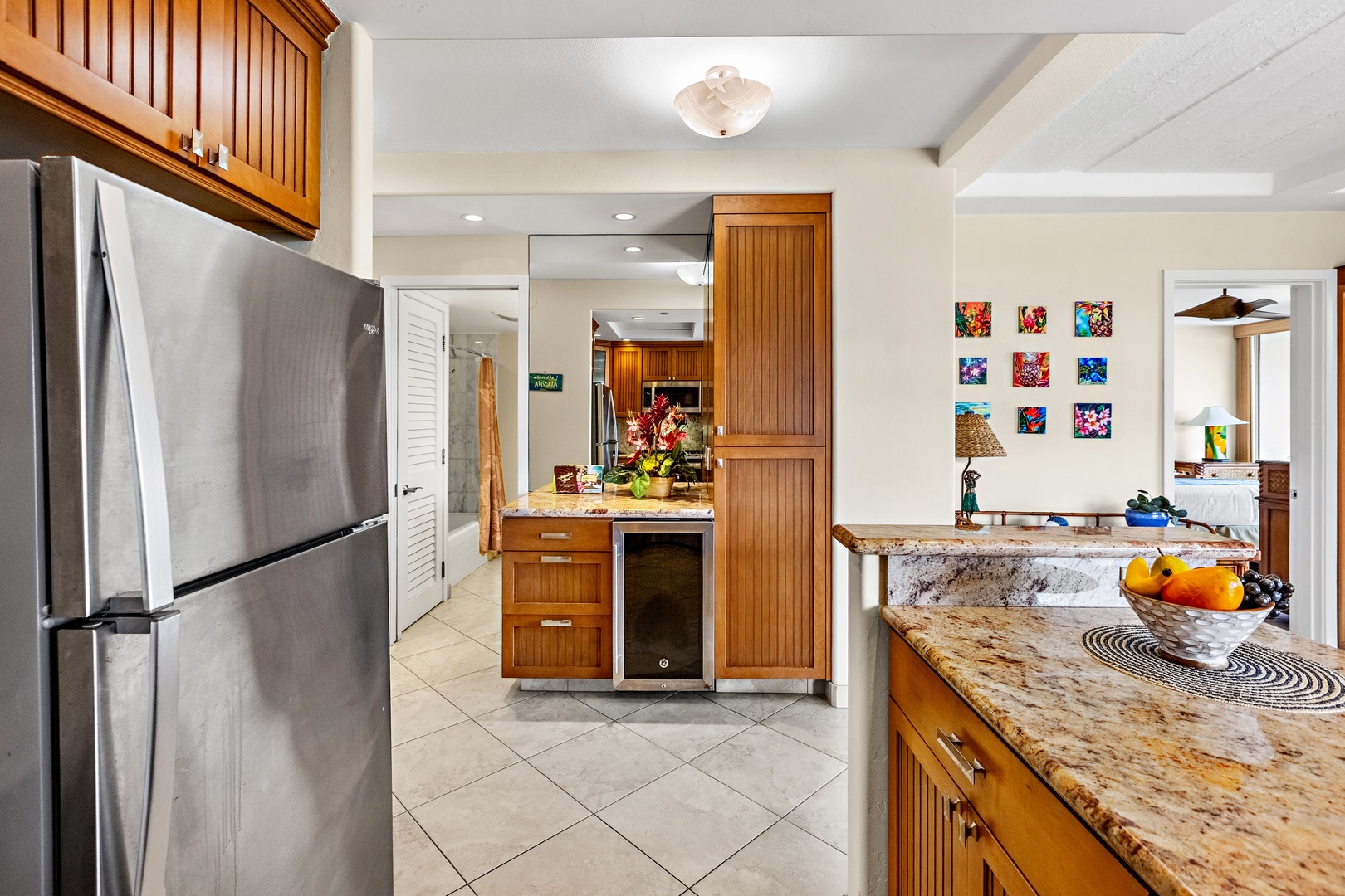 Step into your gourmet kitchen featuring warm wood cabinetry, granite countertops, and stainless steel appliances—perfect for creating memorable meals.