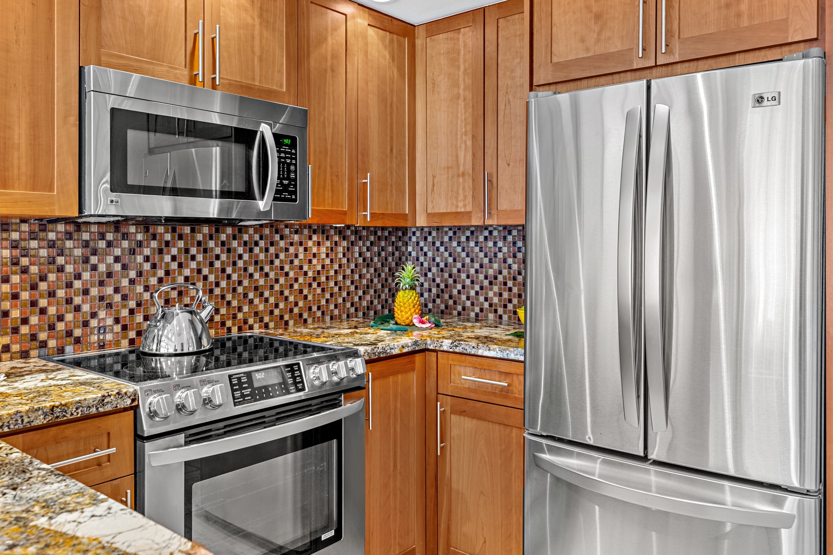 Cook your favorite meals in this fully-equipped kitchen with stainless steel appliances, sleek countertops, and modern conveniences for effortless vacation dining.