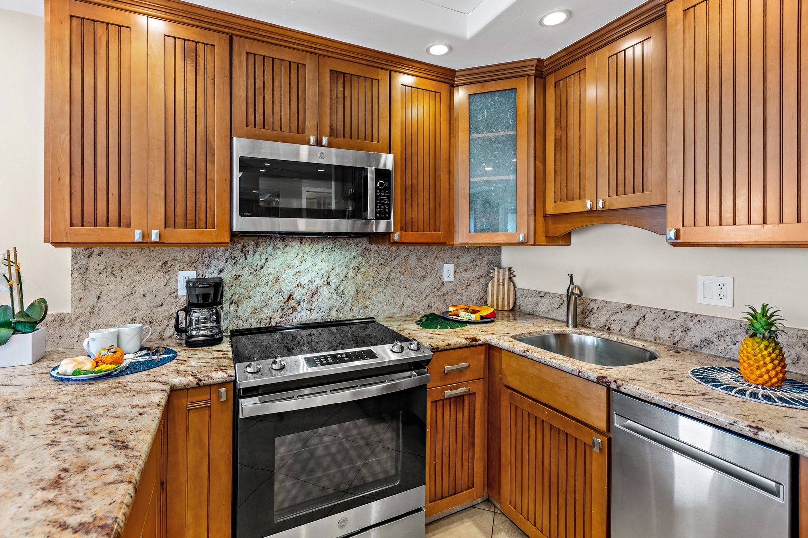 Prepare tropical meals in your fully-equipped kitchen with granite countertops and modern appliances, perfect for vacation cooking.