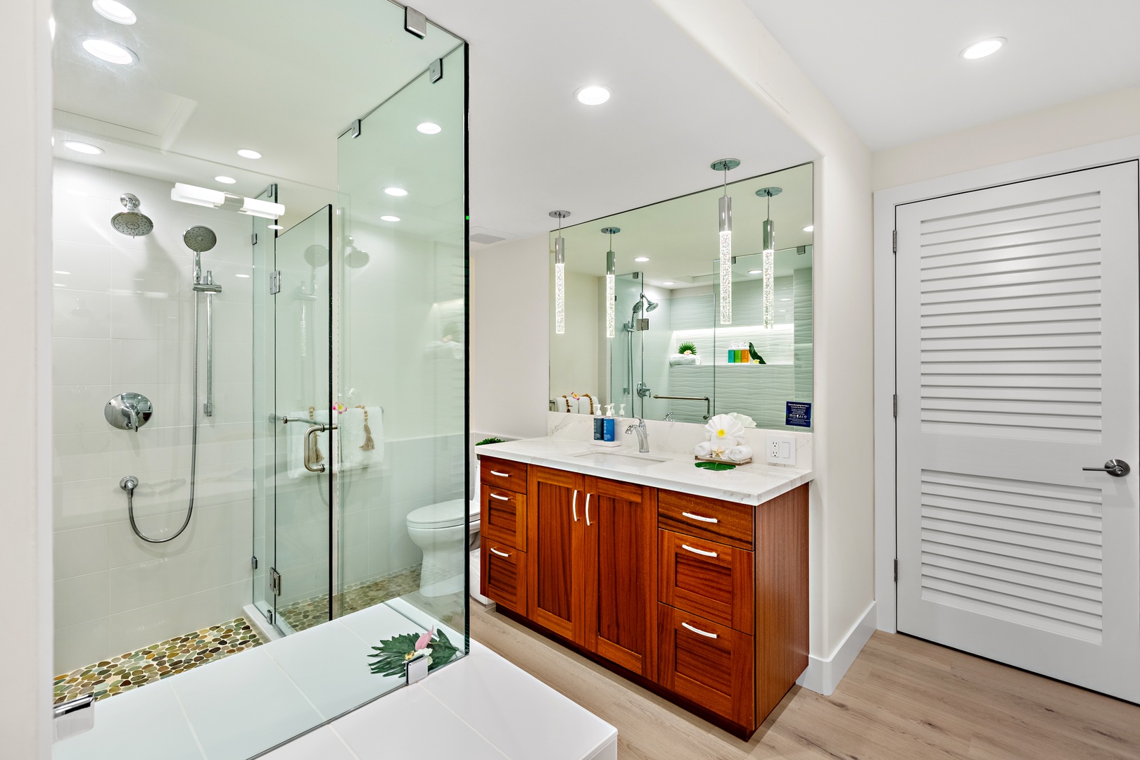 Step into a spacious walk-in shower designed for a spa-like experience. Featuring sleek finishes and a refreshing, open design. Perfect for rinsing off after a day in the sun and sand.