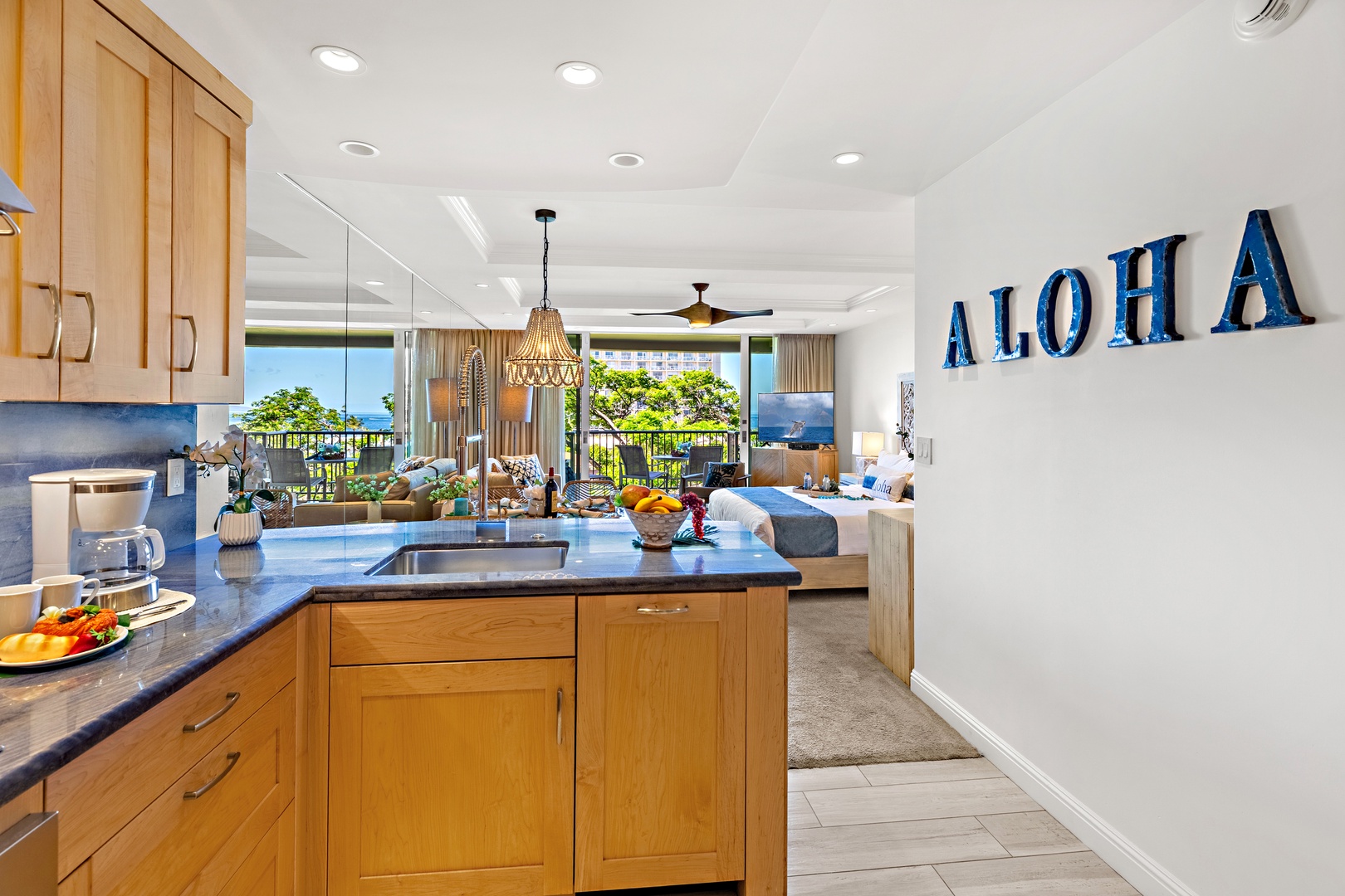 Your fully equipped kitchen opens to a bright living space with stunning ocean views—perfect for preparing meals while soaking in island beauty and tropical breezes.