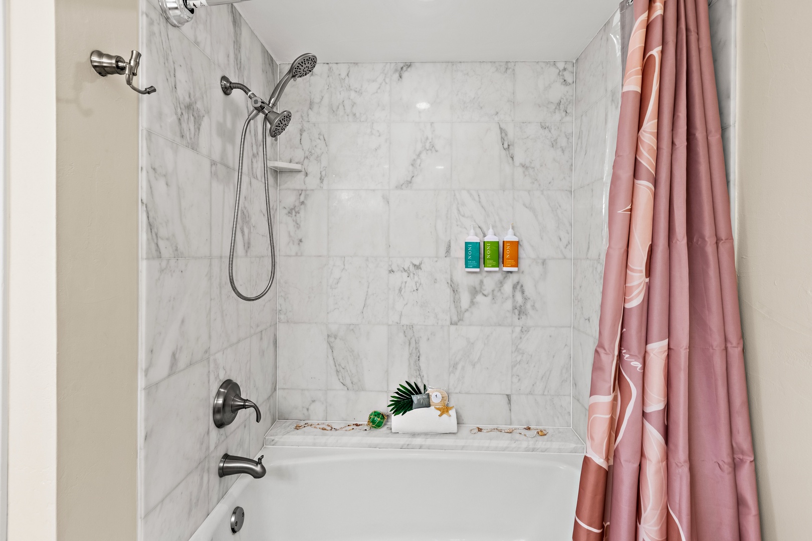 Slip into your marble-wrapped sanctuary with a dual showerhead system and luxurious amenities waiting to refresh you.