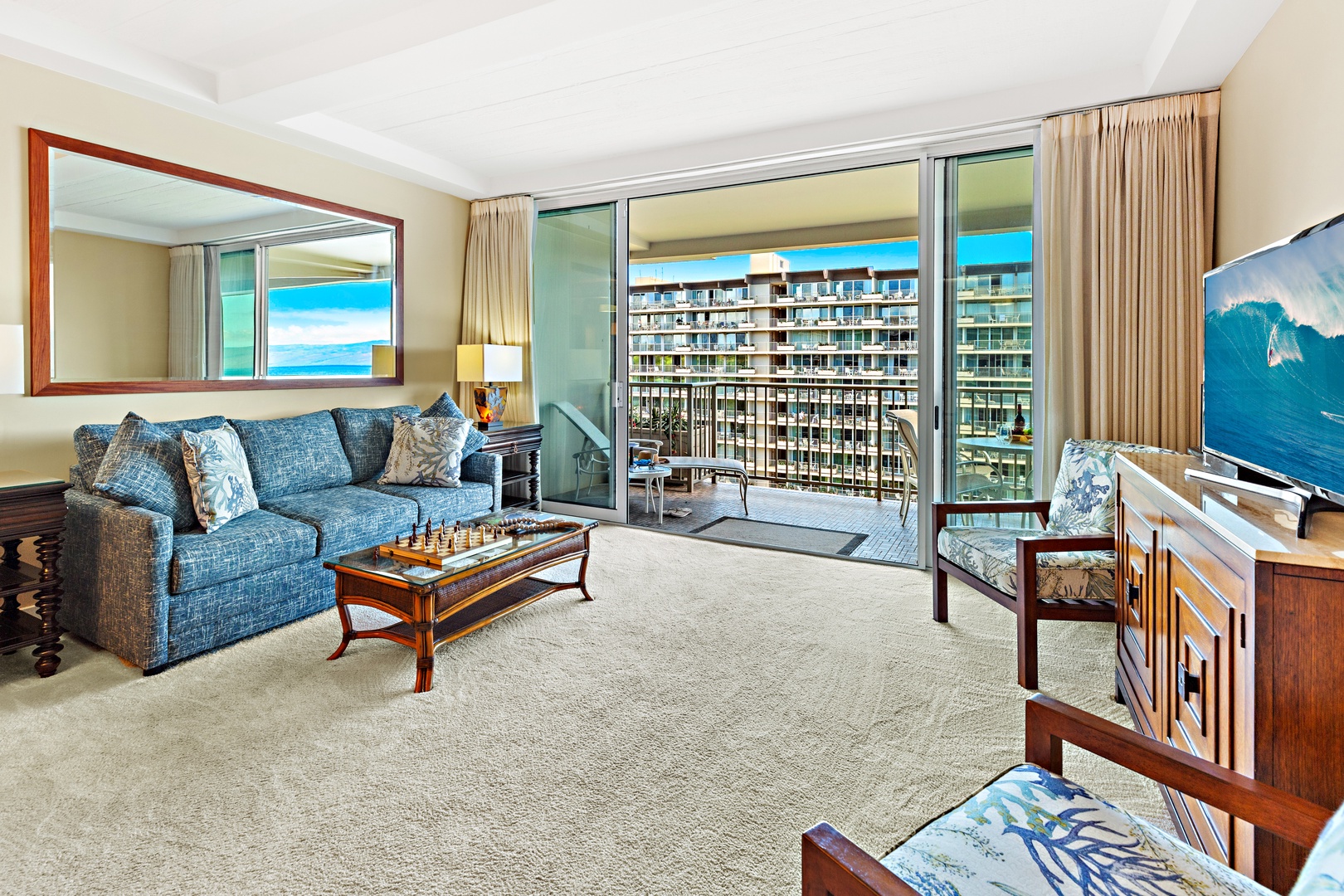 Relax on plush seating with ocean-themed accents and step onto your private balcony overlooking the sparkling sea—a perfect blend of comfort and coastal charm.