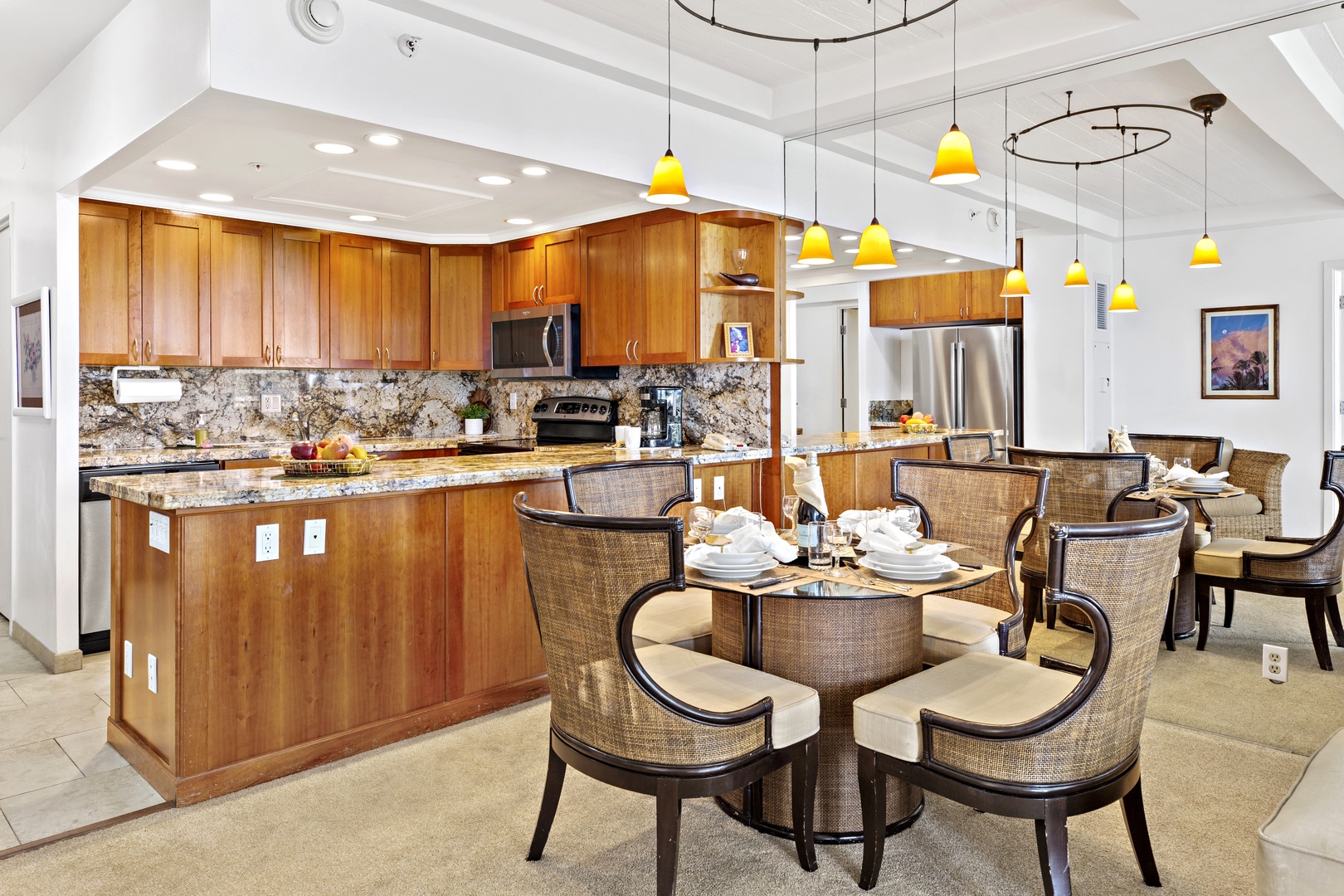 Your fully equipped kitchen features granite countertops and stainless steel appliances, while the elegant dining area invites memorable meals together.