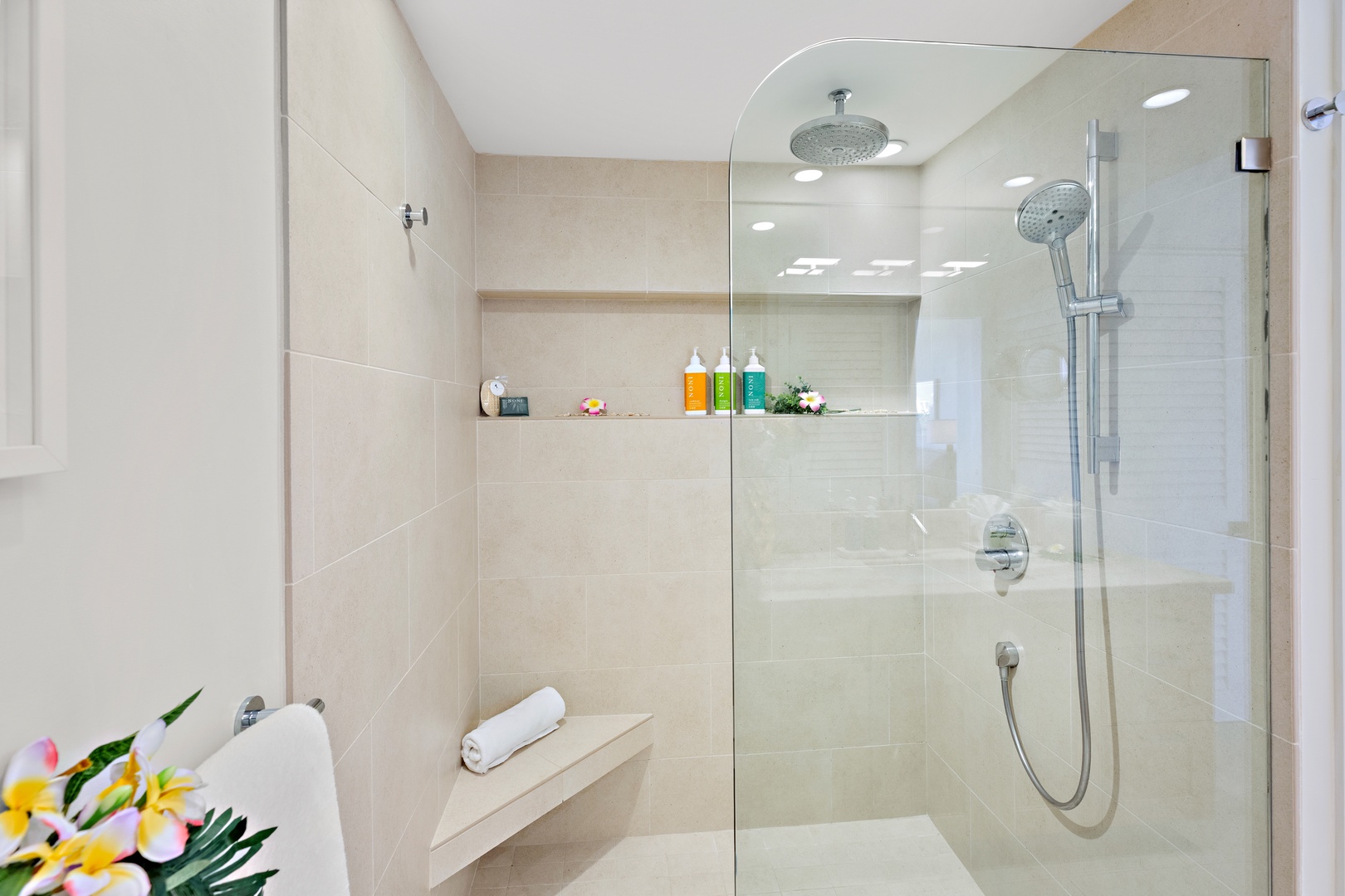 Your spacious walk-in shower features a rainfall and handheld showerhead combo, with a built-in shelf stocked with premium bath amenities to refresh after a day of exploring.