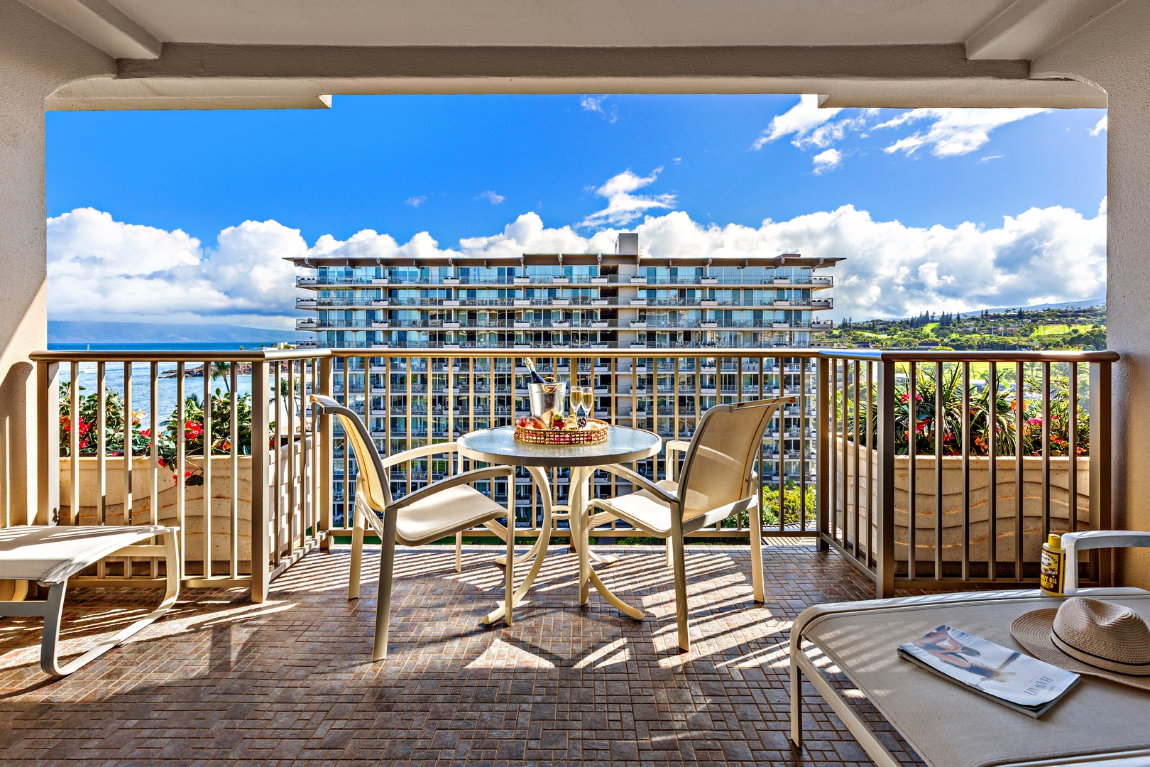 Expansive balcony overlooking blue ocean waters and lush coastal scenery. Perfect spot to enjoy tropical morning coffee or catch stunning sunsets with the soothing sounds of waves below.