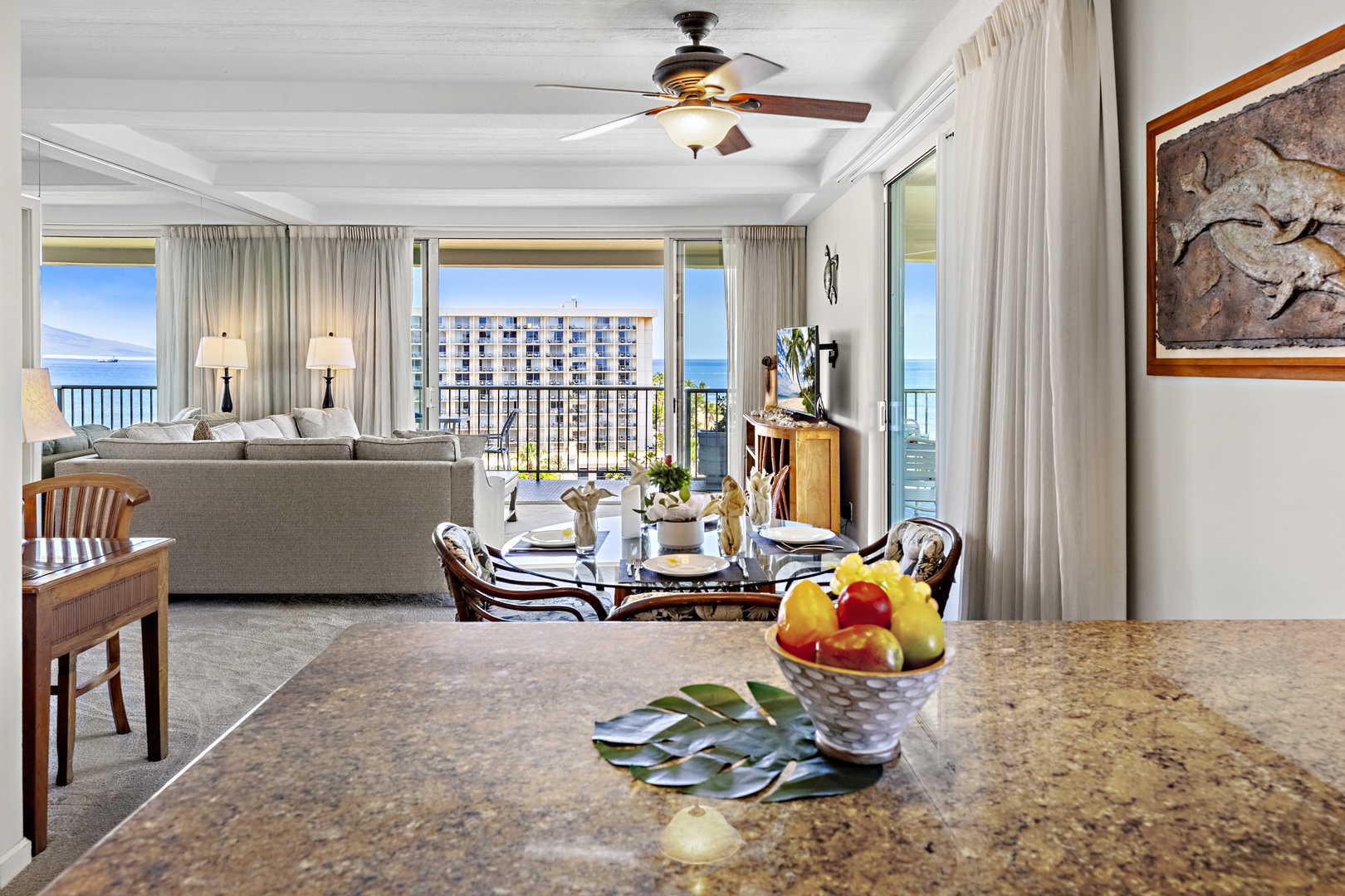 Relax in your bright, open living space where ocean breezes meet island charm—perfect for unwinding after a day at the beach or sharing meals with loved ones.