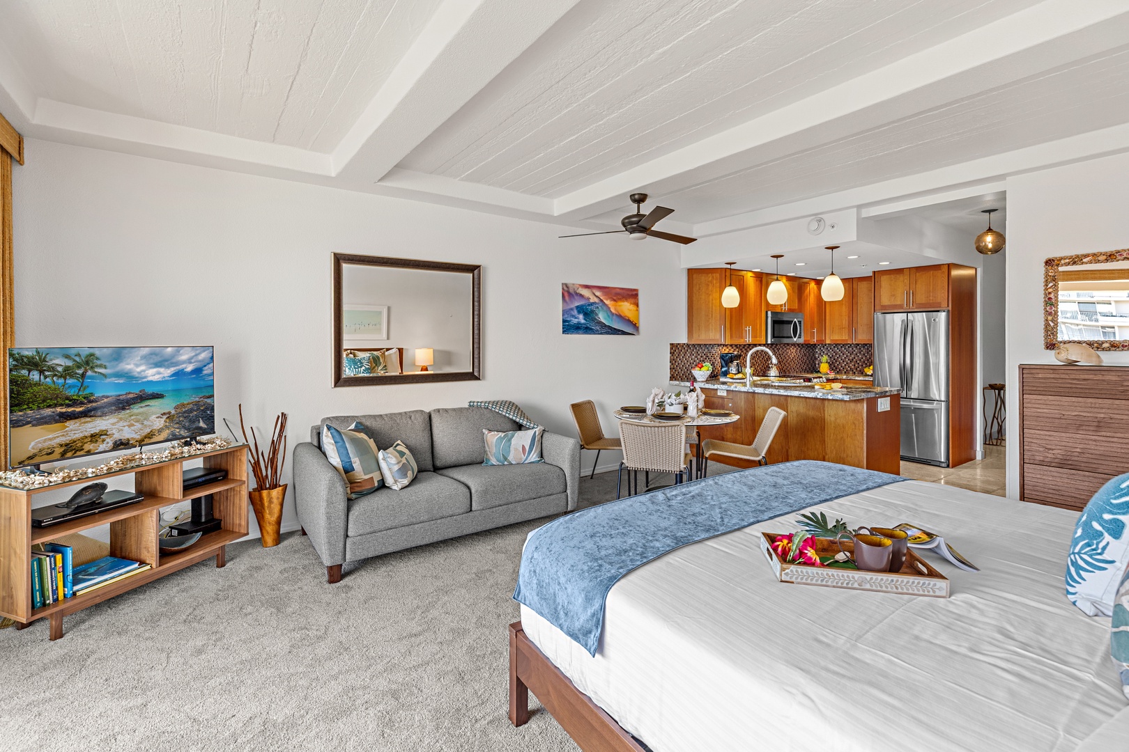 Relax in your spacious open-concept suite featuring a plush king bed, cozy living area, and fully equipped kitchen. Ocean-inspired decor and modern comforts create your perfect island retreat.