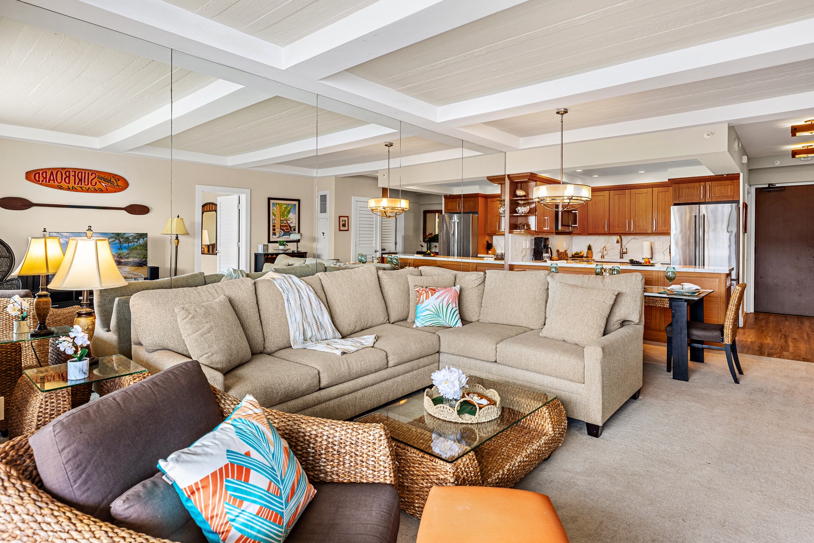 Unwind in your spacious open-concept living area where coastal charm meets modern comfort, complete with plush seating and a gourmet kitchen.  Spacious living area featuring a comfortable pull-out sofa sleeper