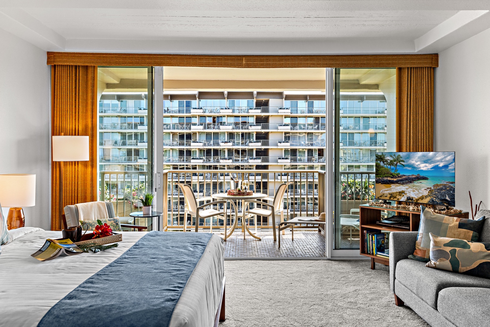 Spacious room with floor-to-ceiling windows framing your private balcony and city views. Modern furnishings invite relaxation, while natural light creates a bright, welcoming retreat.
