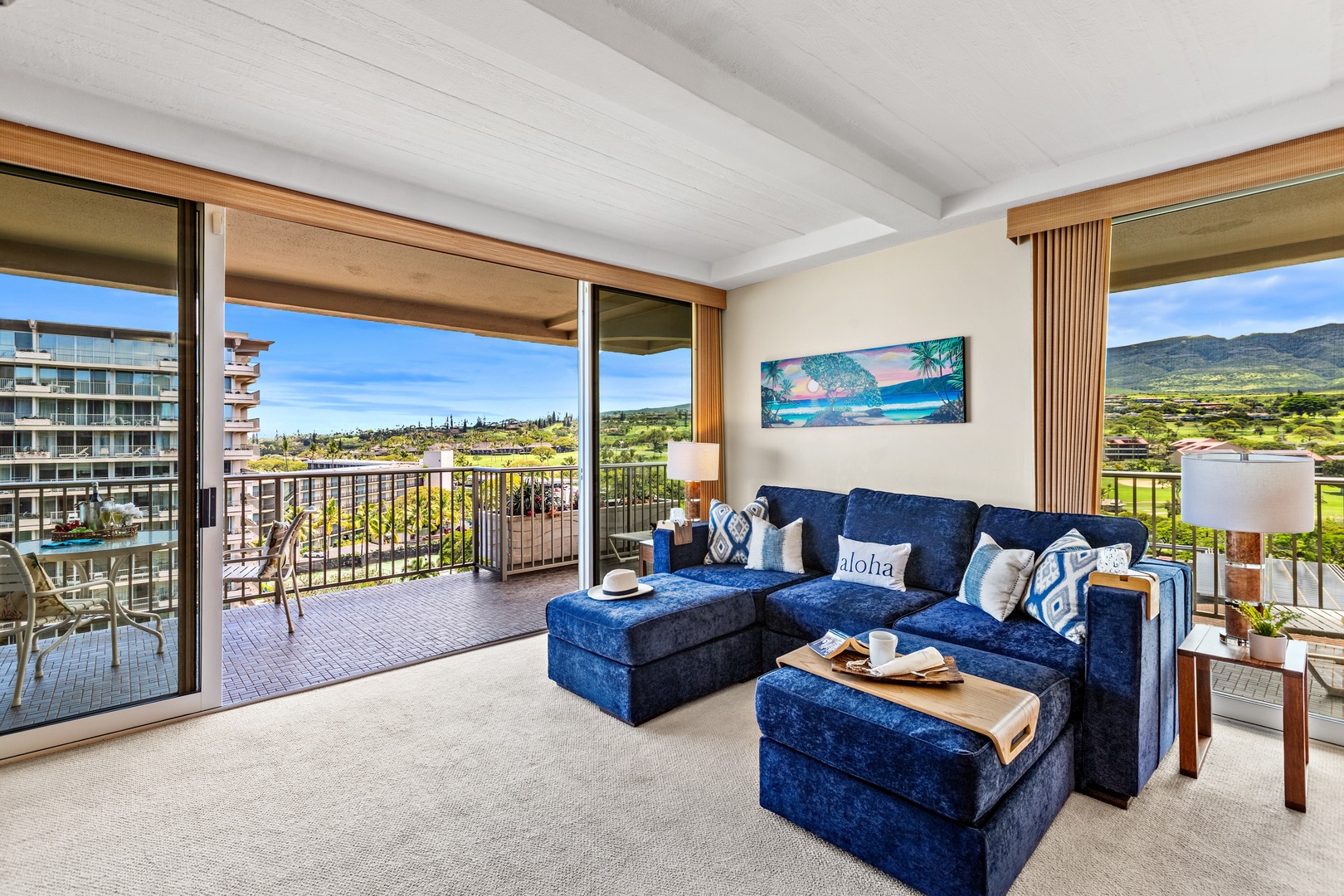 Unwind on your plush sectional while soaking in stunning mountain and golf course views through floor-to-ceiling windows.