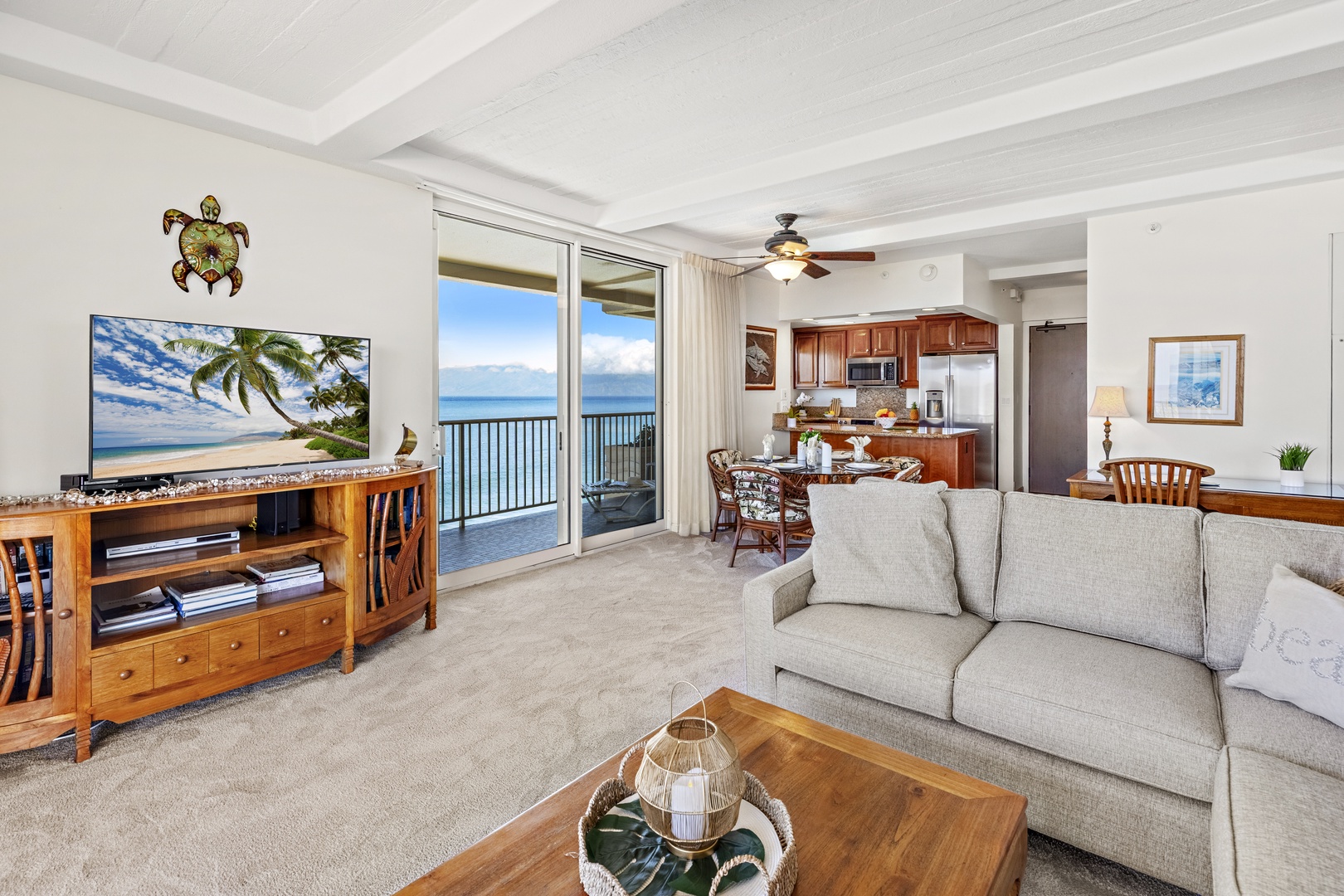 Your open-concept haven where cozy living meets a fully-equipped kitchen and a stunning oceanfront balcony—perfect for relaxing, dining, and soaking in panoramic sea views.