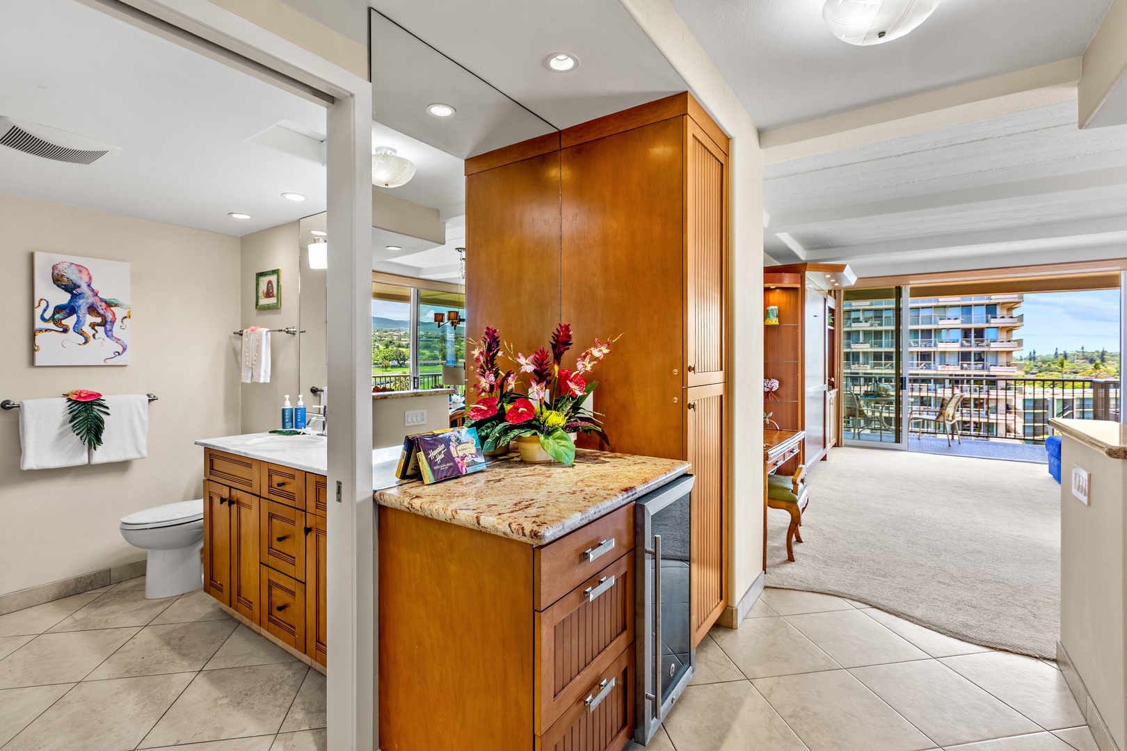 Your spacious kitchen features warm wood cabinetry, granite counters, and modern appliances, creating the perfect space for preparing meals during your getaway.
