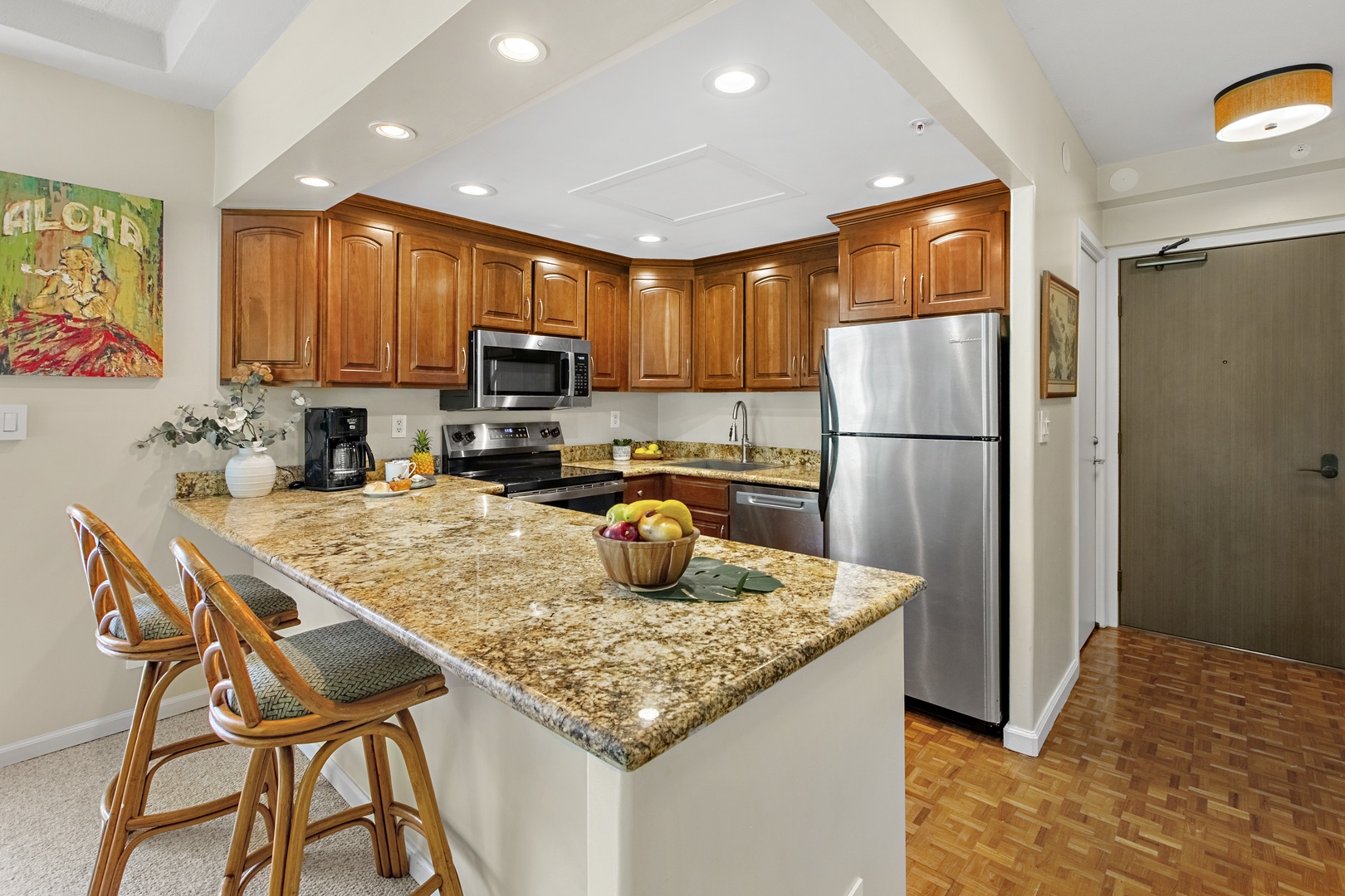 Your spacious kitchen features granite countertops, stainless steel appliances, and a breakfast bar where you can enjoy morning coffee while planning your day.
