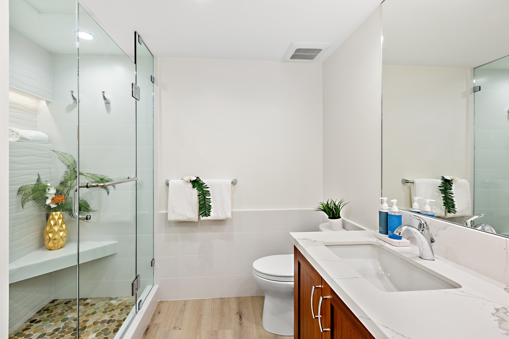 Step into a spacious walk-in shower designed for a spa-like experience. Featuring sleek finishes and a refreshing, open design. Perfect for rinsing off after a day in the sun and sand.