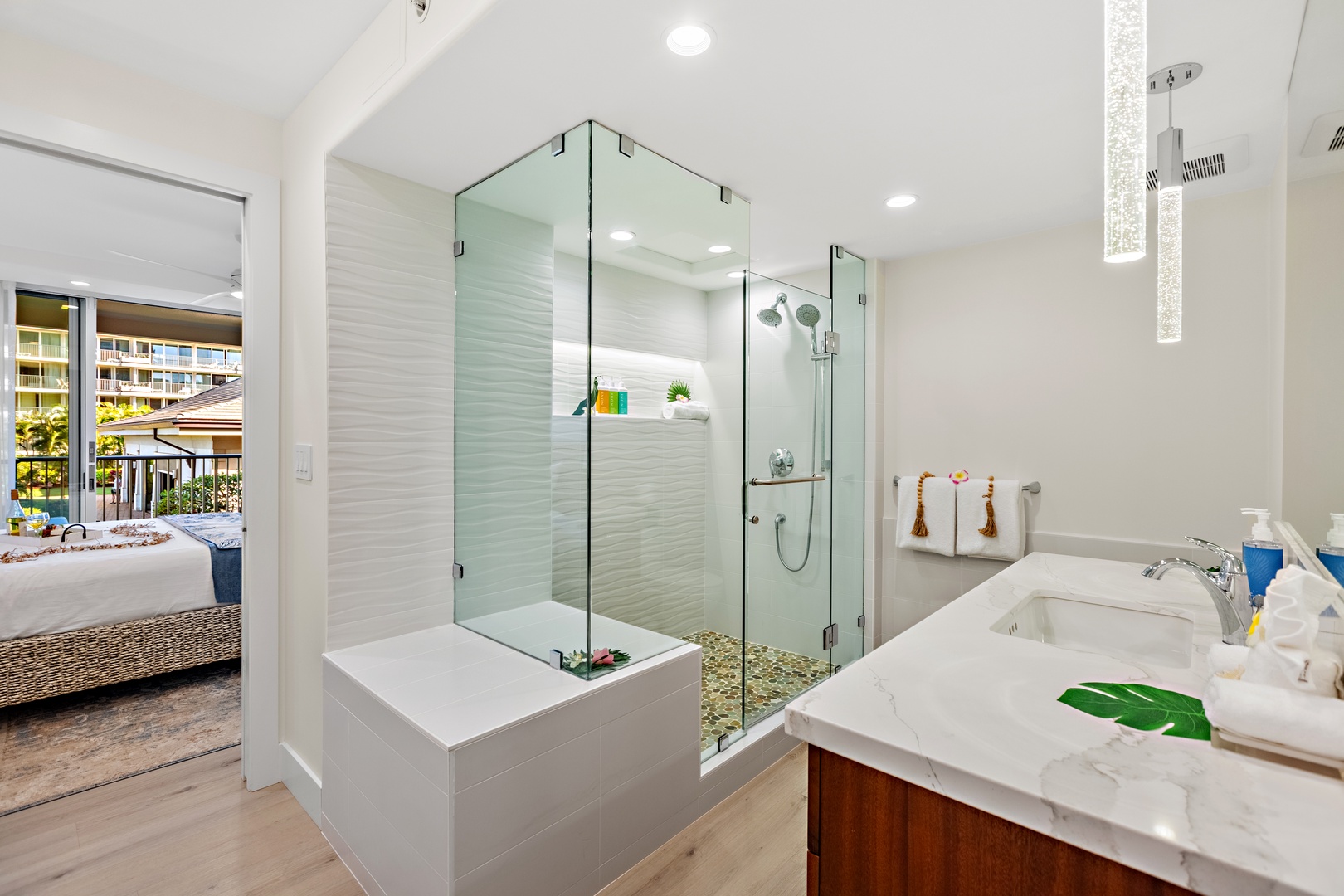 Step into a spacious walk-in shower designed for a spa-like experience. Featuring sleek finishes and a refreshing, open design. Perfect for rinsing off after a day in the sun and sand.