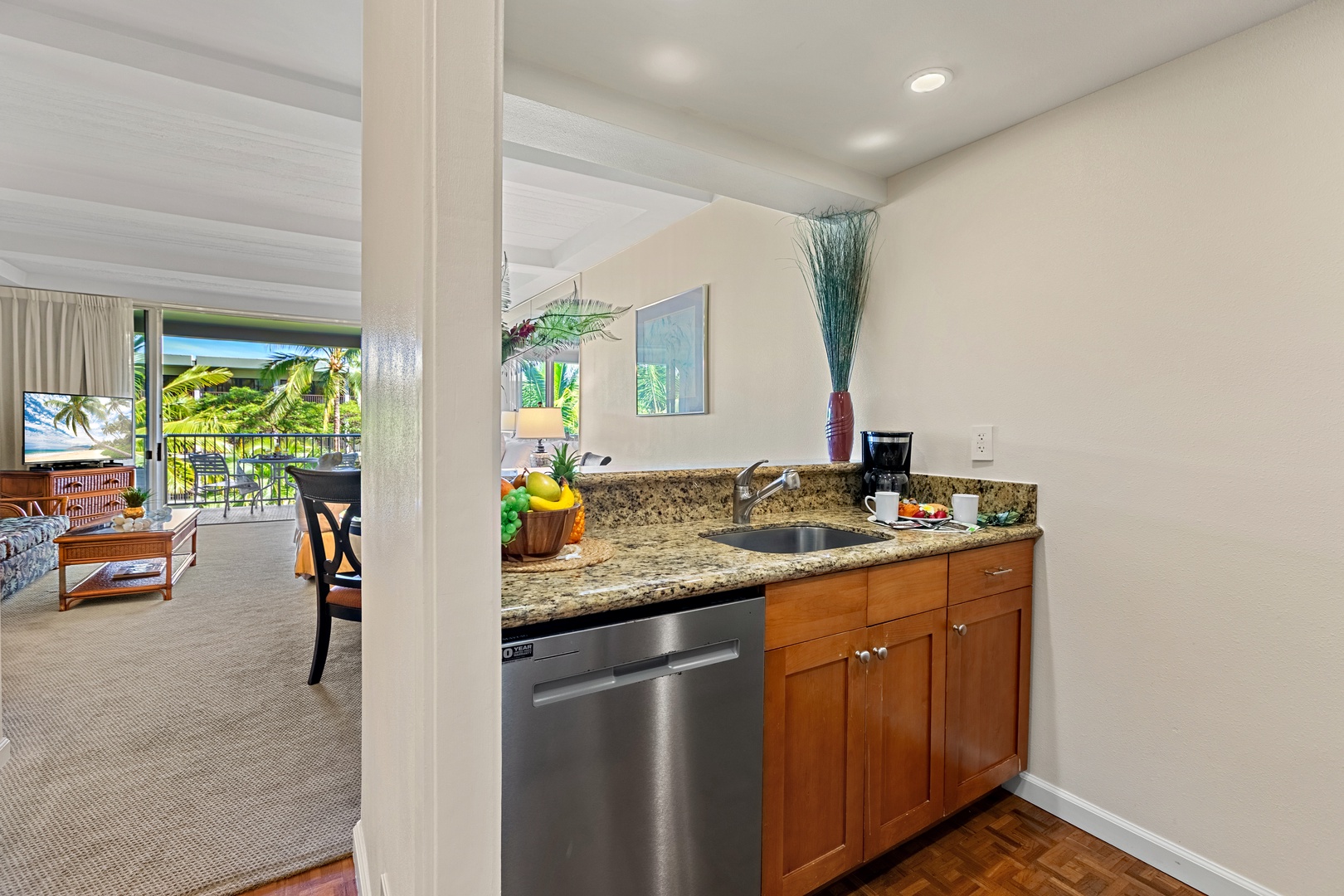 Your gourmet kitchen awaits with cabinetry, counters, and stainless-steel appliances. Perfect for preparing memorable meals together.