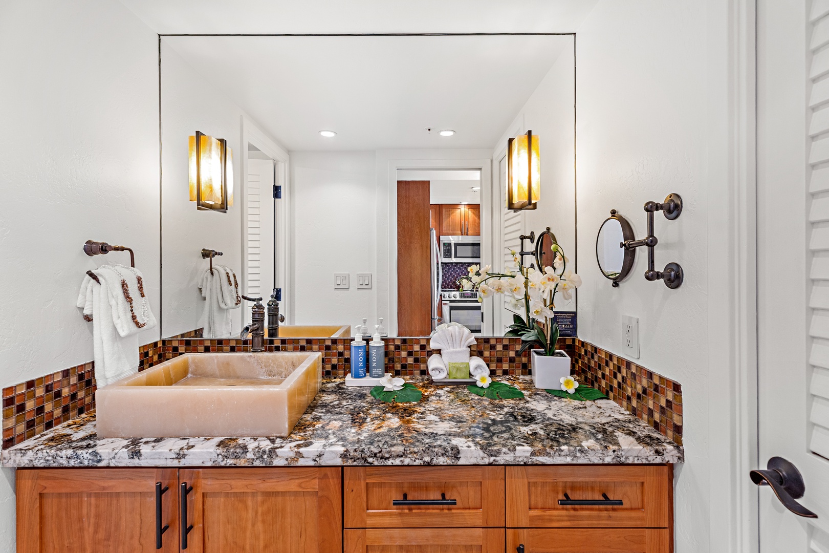Refresh in your private bath with a handcrafted copper sink, elegant granite counters, and plush towels—your own serene retreat awaits.