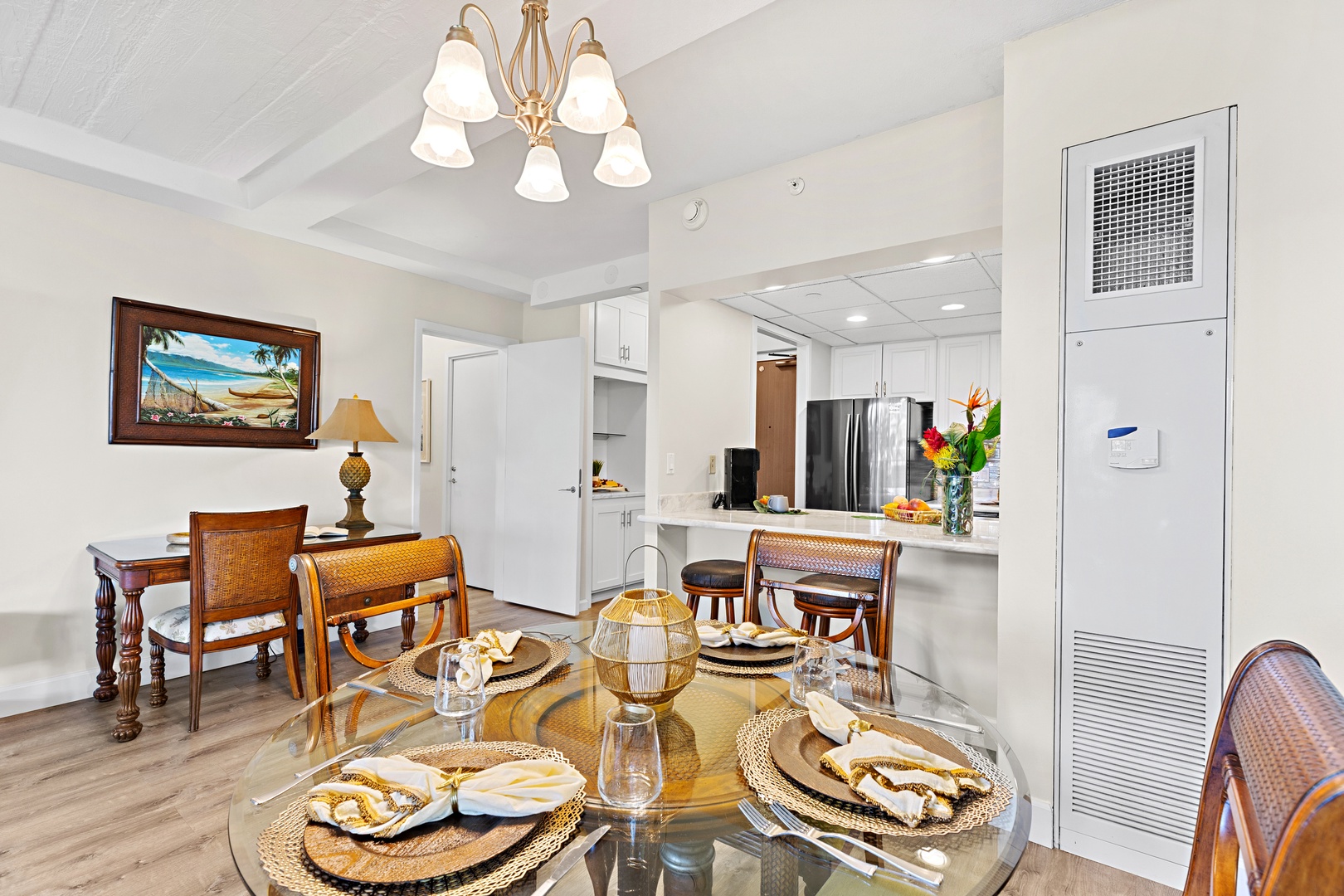 Gather around the beautifully set dining table where tropical charm meets island elegance. Enjoy meals in comfort with modern kitchen access and bright, open space perfect for your group.