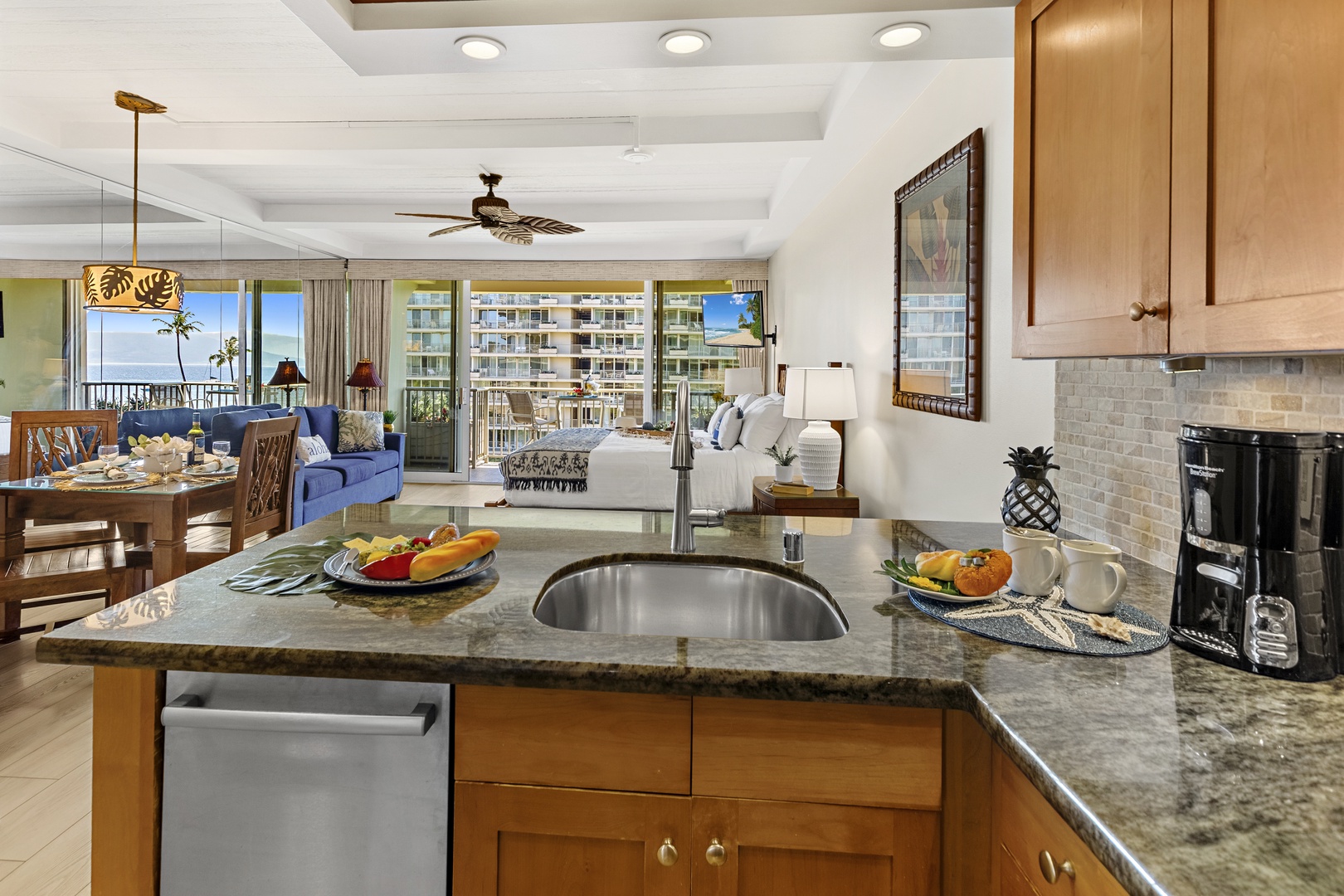 Your modern kitchen opens to a bright living space with ocean views, perfect for preparing meals while staying connected to the conversation.