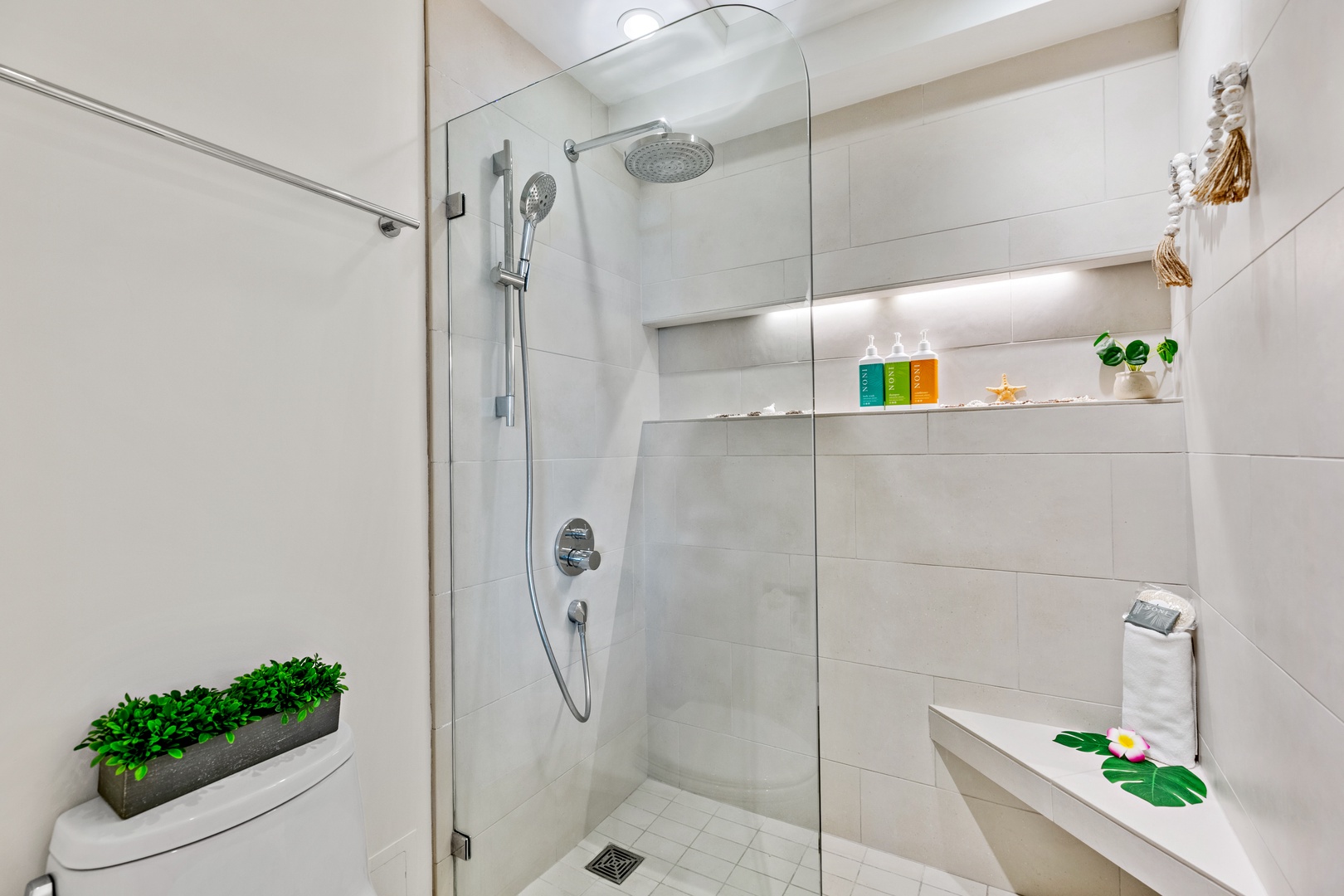Step into your sleek, modern bathroom with a refreshing walk-in shower featuring dual showerheads, perfect for rinsing off after a day of adventure.
