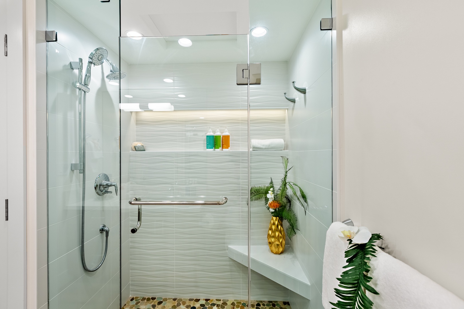 Step into a spacious walk-in shower designed for a spa-like experience. Featuring sleek finishes and a refreshing, open design. Perfect for rinsing off after a day in the sun and sand.