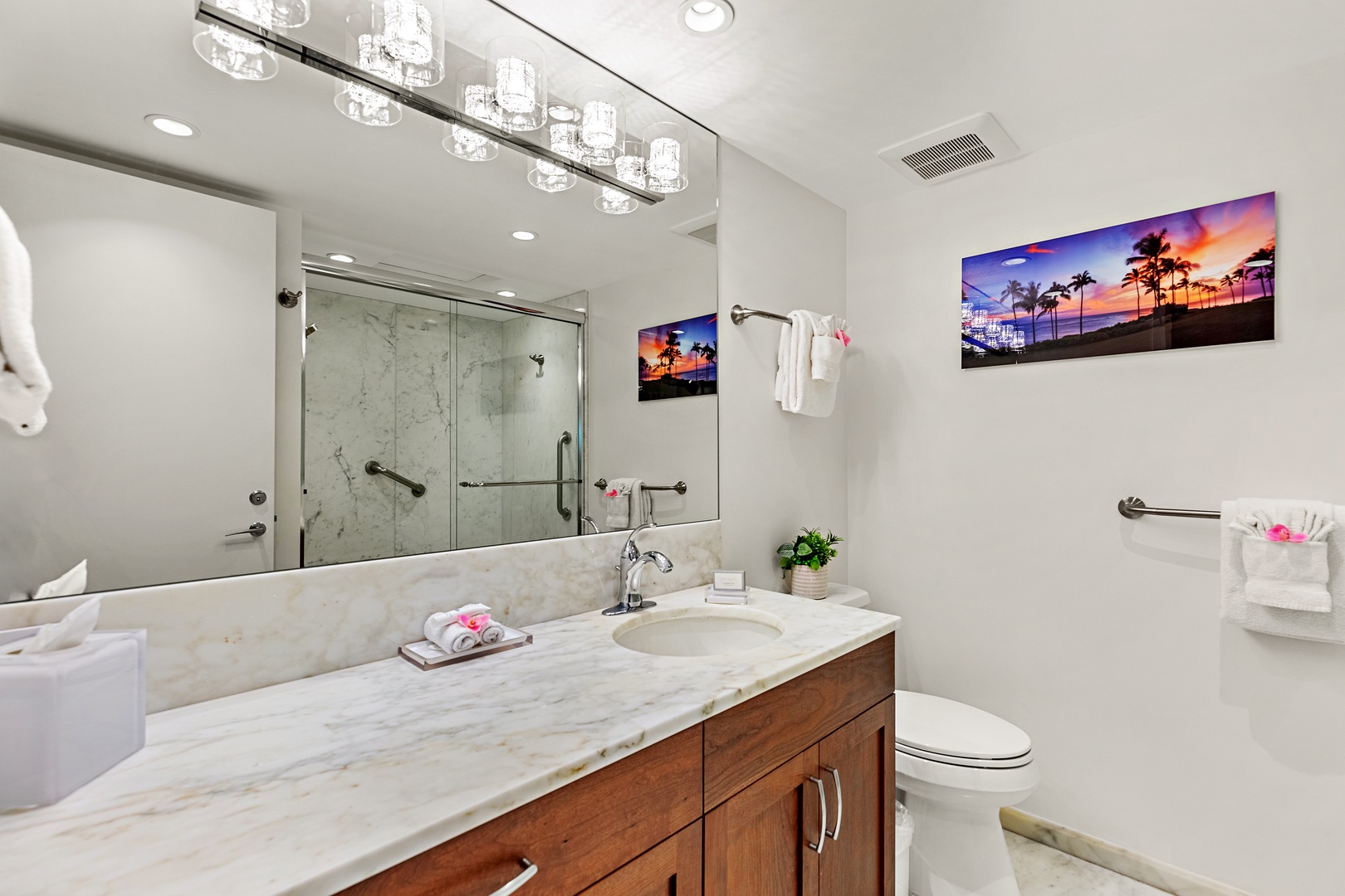 Elevated comfort and thoughtful design. A beautifully appointed guest bathroom featuring a spacious vanity and refined finishes that bring a touch of island luxury to your everyday routine.