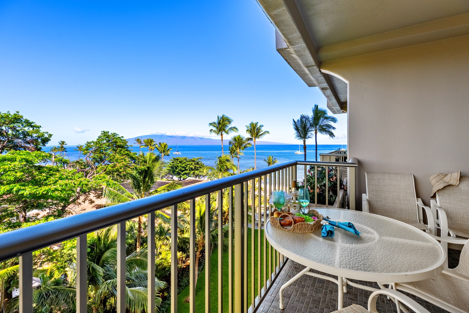 Sip your morning coffee from this private balcony overlooking stunning ocean views and swaying palms. A perfect spot to relax and soak in paradise.
