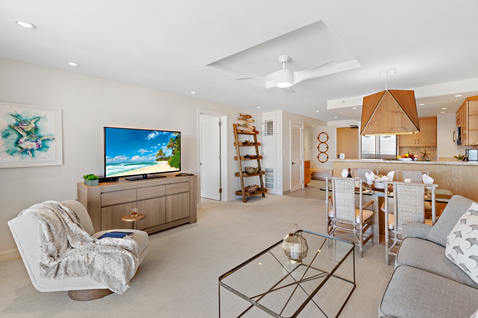 Unwind in this bright, open living space where coastal elegance meets comfort. Relax on plush seating, enjoy your favorite shows, or gather at the dining area for memorable meals together.