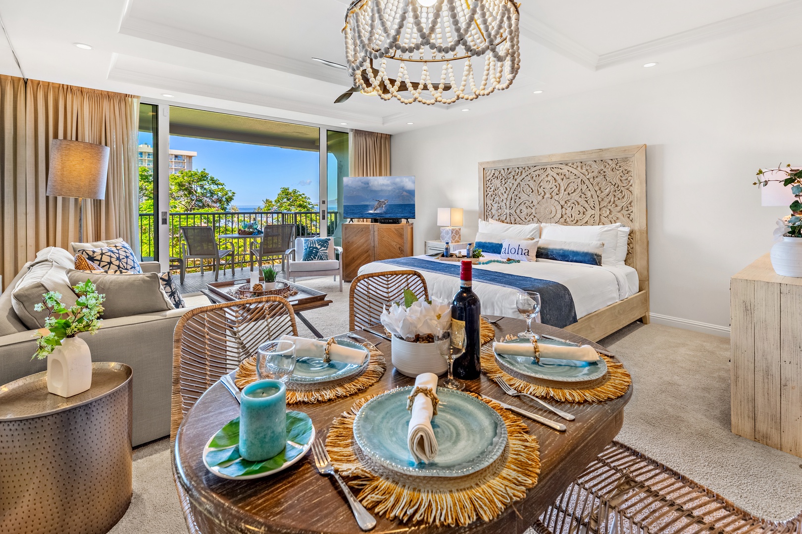 Open-plan studio where dining, living, and sleeping areas blend seamlessly—you'll enjoy tropical views, coastal décor, and a chandelier that adds island elegance to your Hawaiian escape.