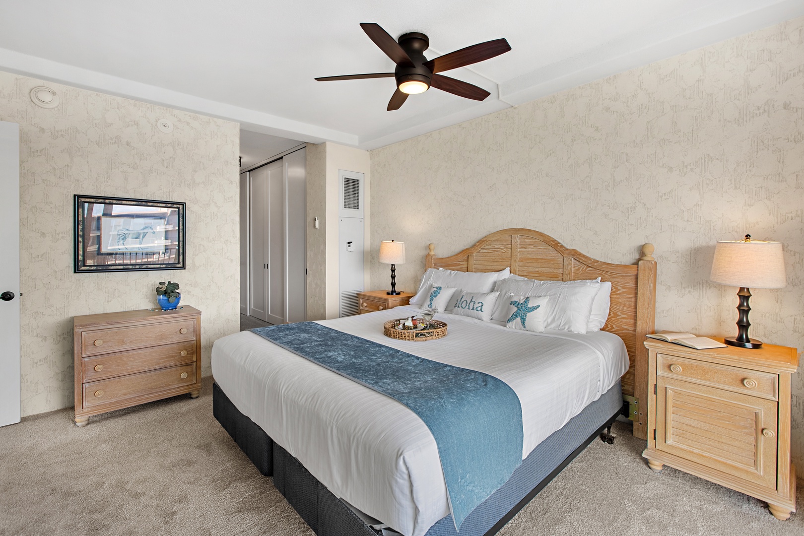 Your coastal retreat awaits with crisp white linens, gentle ocean-inspired accents, and soft light creating the perfect sanctuary for your island escape.