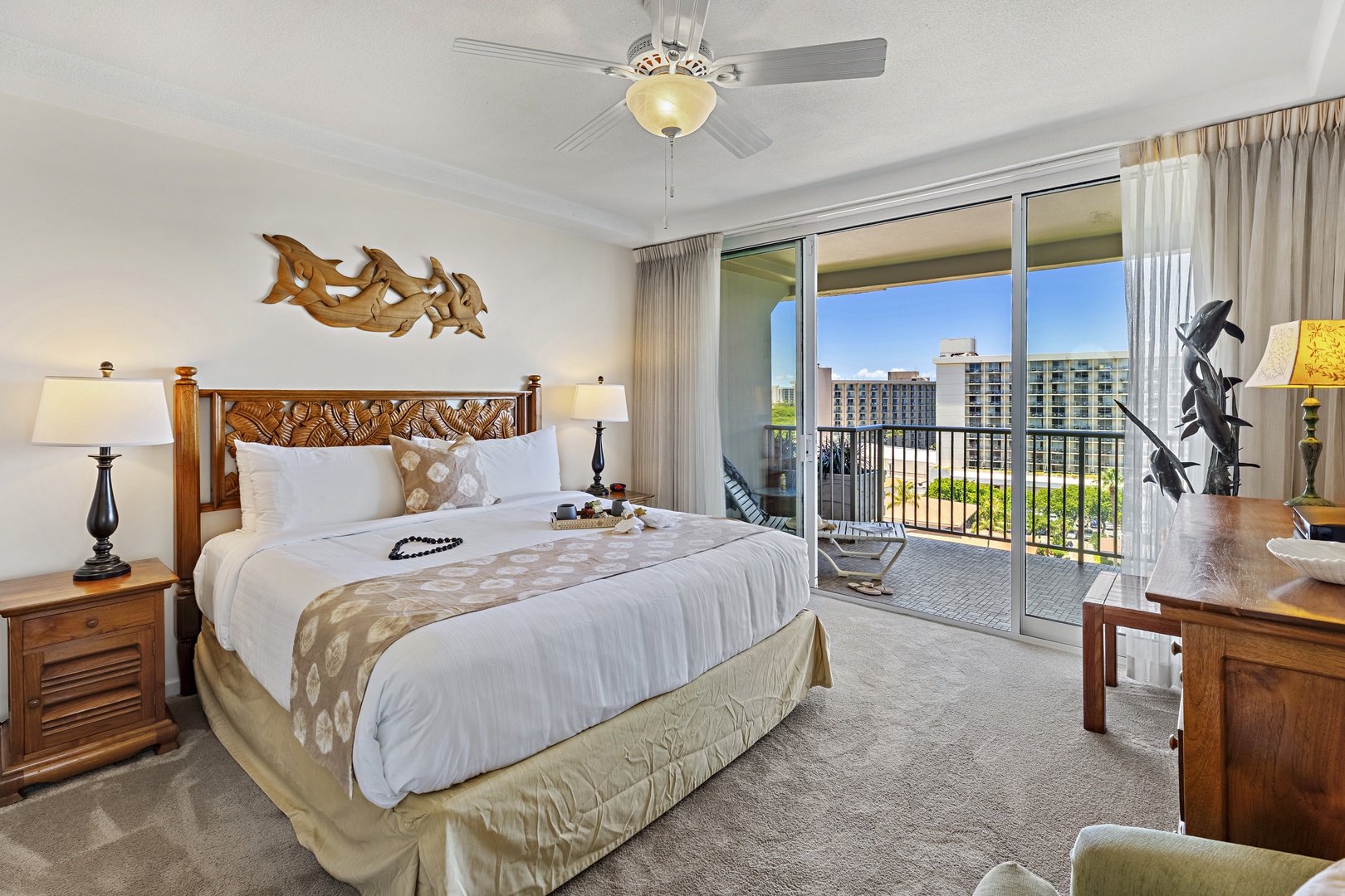 Slip into crisp linens and admire handcrafted island art. Your balcony opens to sunny skies and modern city views, bringing tropical warmth indoors.