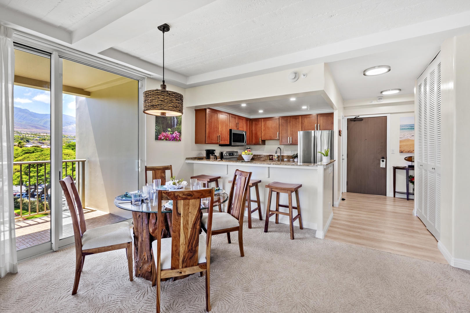 An inviting dining space where island elegance meets breathtaking ocean views. Gather around the beautifully set table, surrounded by warm textures, coastal-inspired décor, and soft ambient lighting.