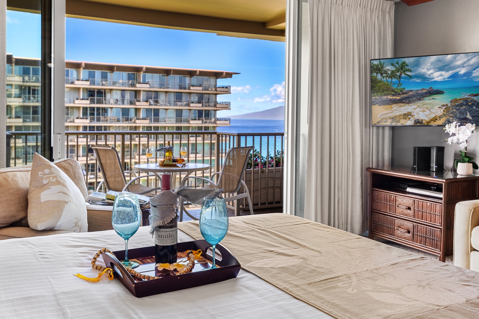 Wake up to stunning ocean views from your luxurious bedroom suite, complete with modern TV entertainment and direct balcony access.