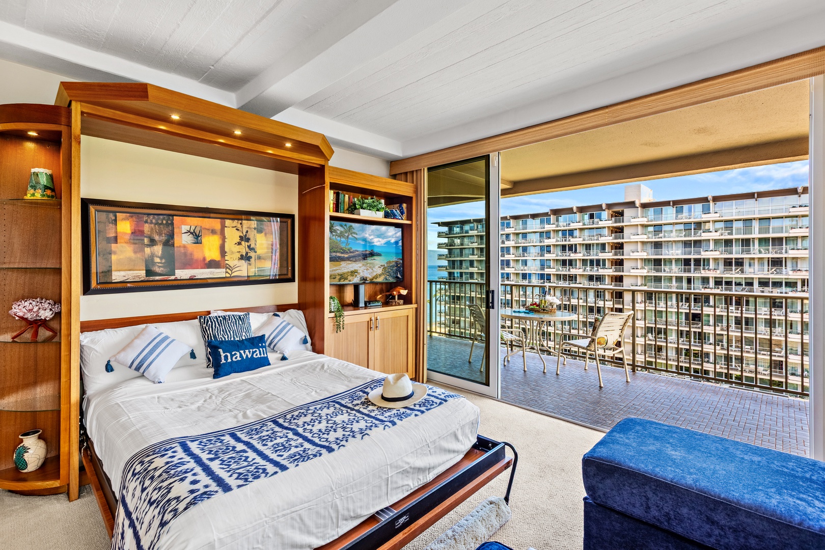 Your studio features a Murphy bed with tropical touches and opens to your private balcony overlooking the city.