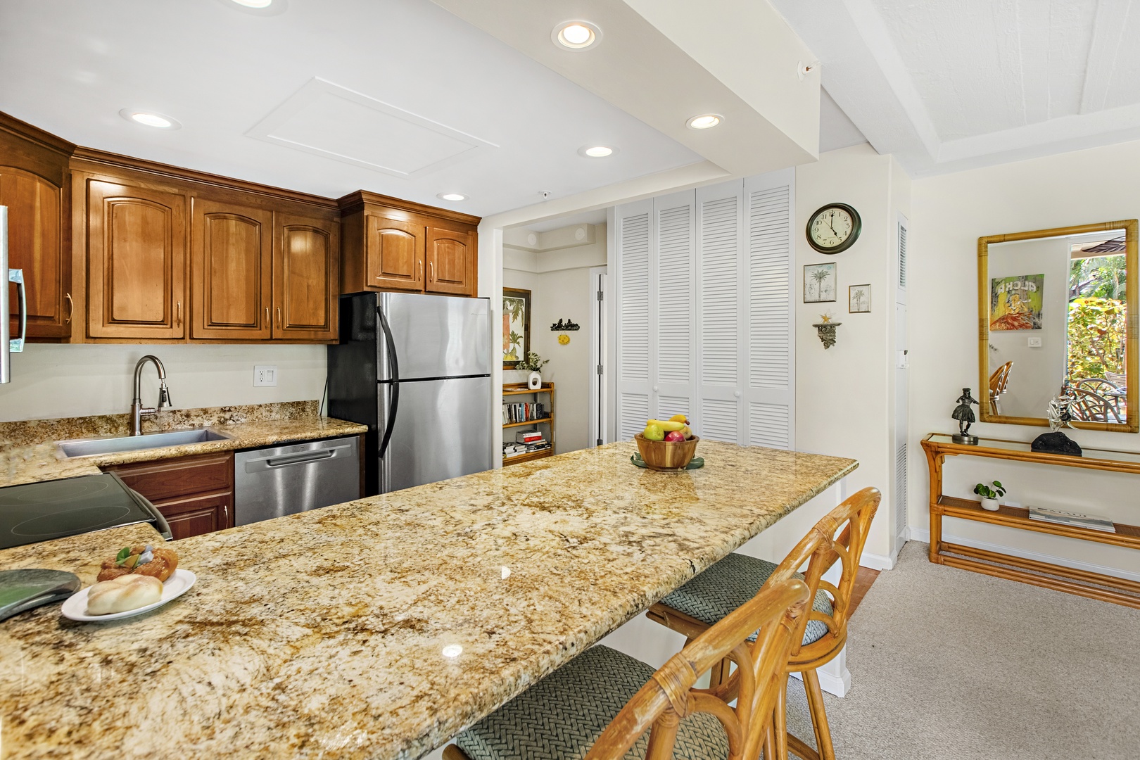 Your fully equipped kitchen features granite countertops, stainless steel appliances, and a breakfast bar where you can savor morning coffee.