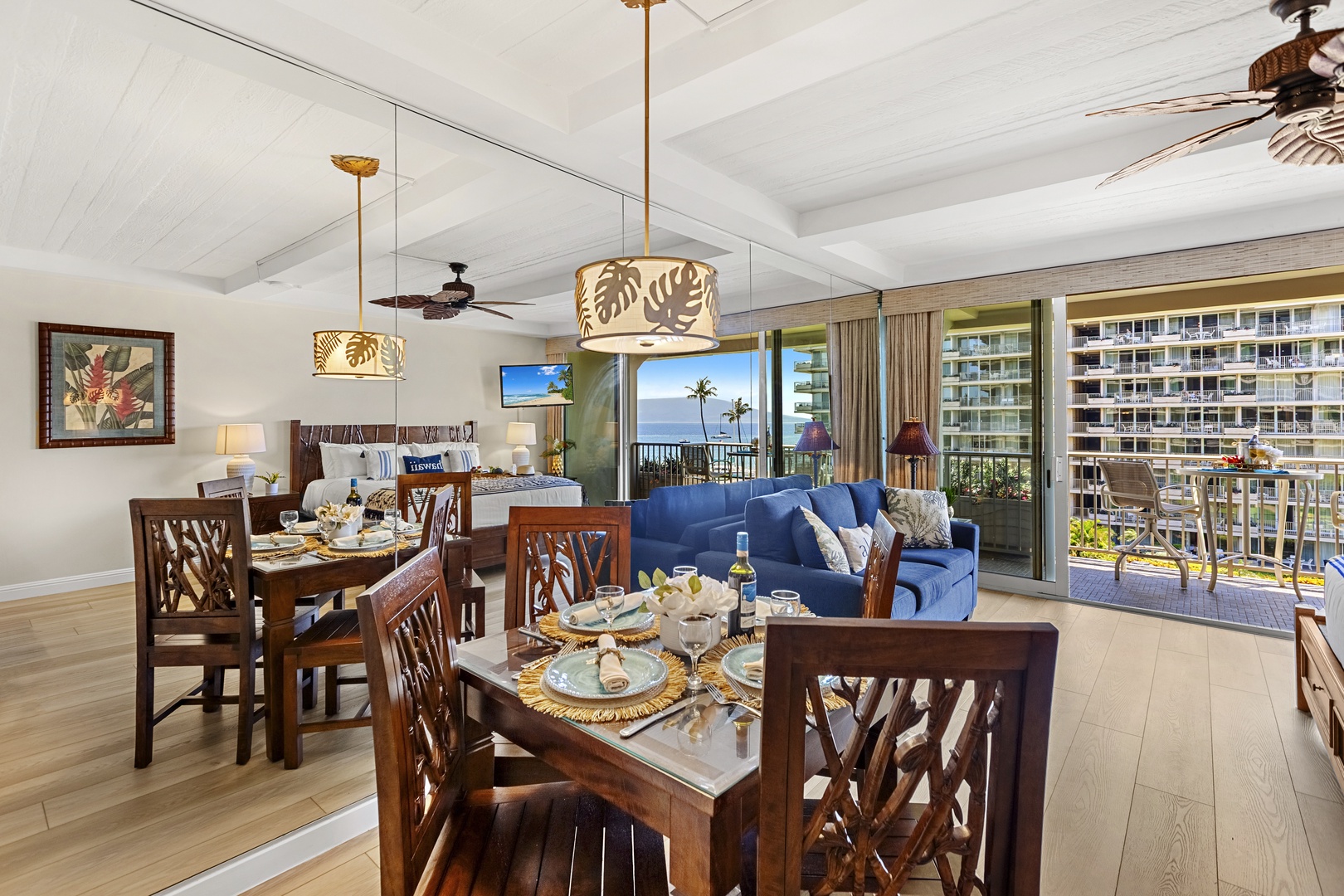 Relax in your spacious tropical suite where warm wood tones meet ocean views through floor-to-ceiling windows.