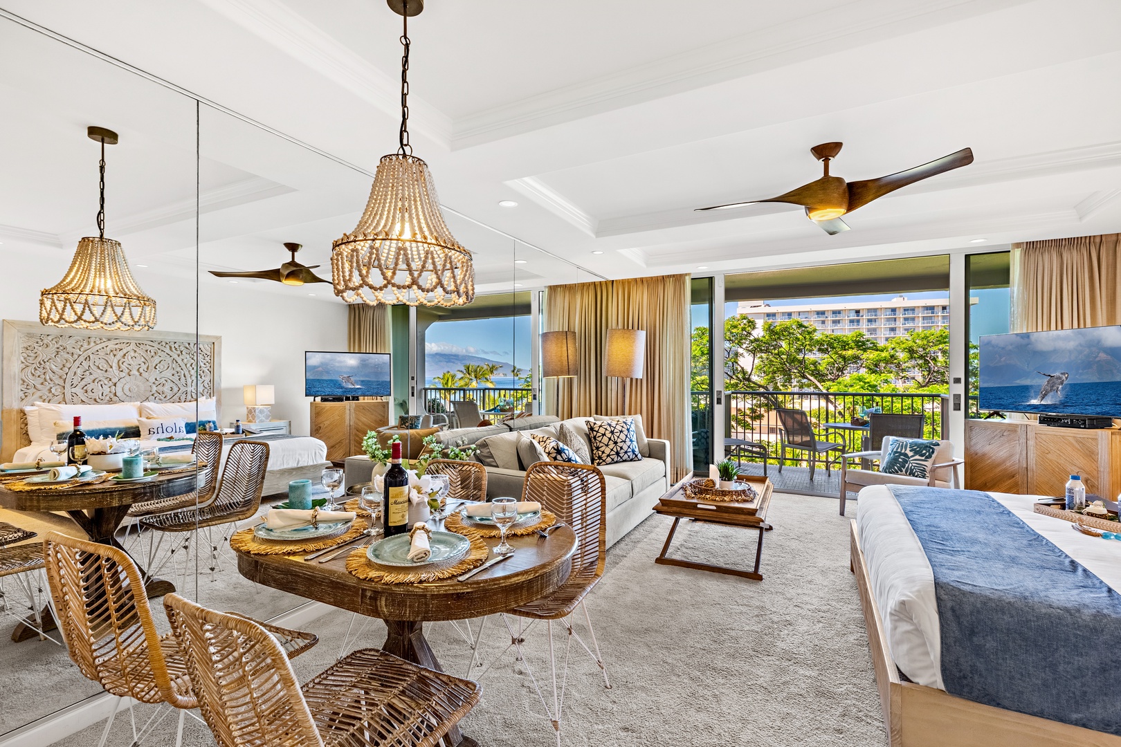 Relax in your bright, coastal-inspired suite with ocean views, elegant beaded chandeliers, and a breezy balcony where the tropical scenery becomes part of your everyday escape.