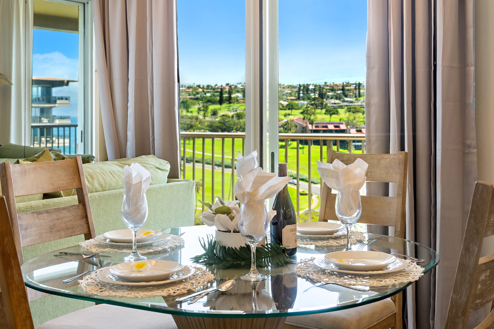 Gather around your private dining table where floor-to-ceiling windows frame sweeping green fairway and village views—perfect for morning coffee or an intimate dinner for four.