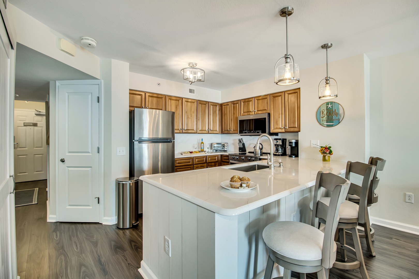 Your fully equipped kitchen invites culinary adventures with granite counters, modern appliances, and a breakfast bar perfect for morning coffee conversations.