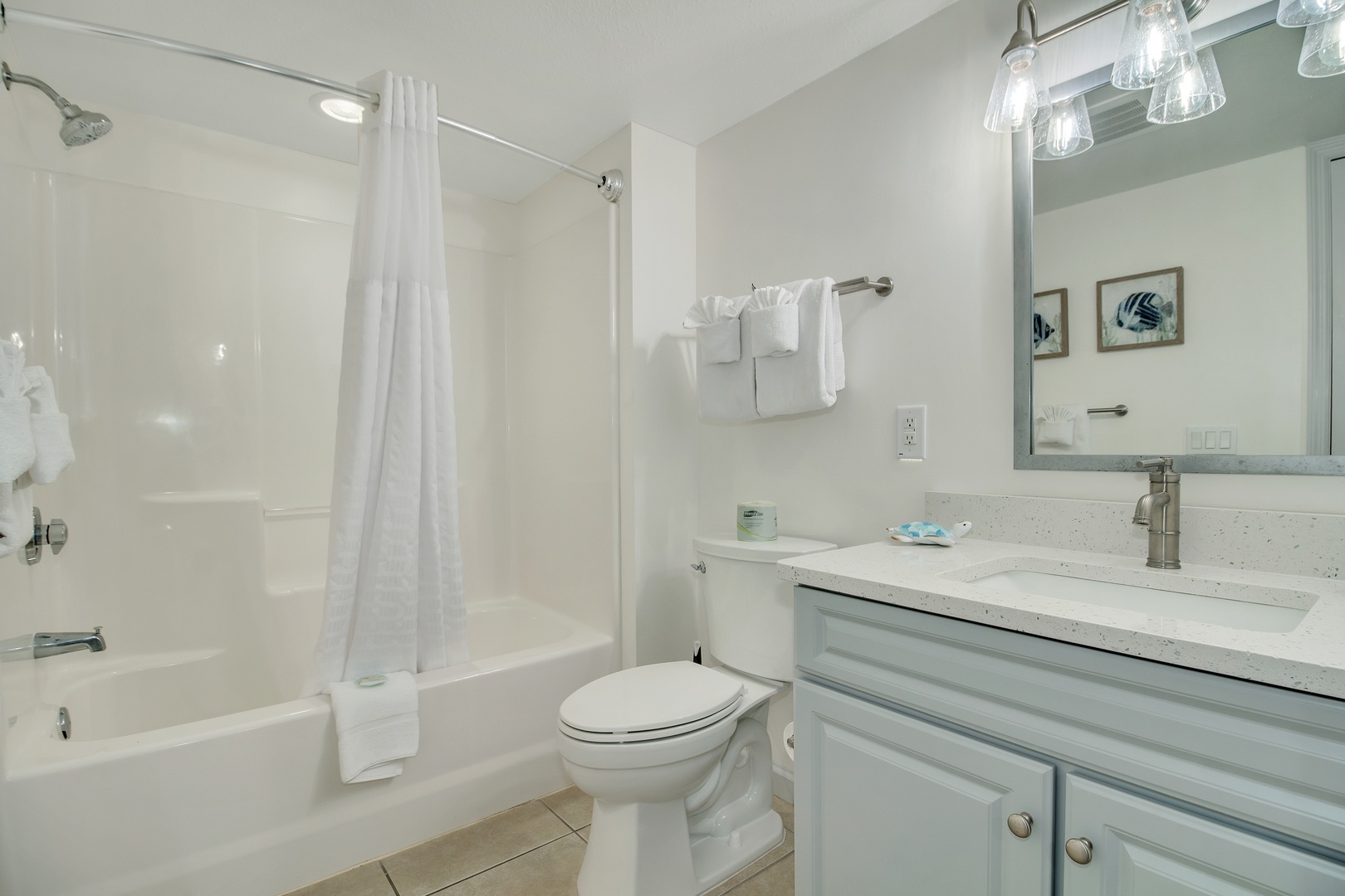 Unwind in your pristine bathroom with spa-inspired fixtures, plush towels, and thoughtful coastal touches that make every morning feel refreshing.