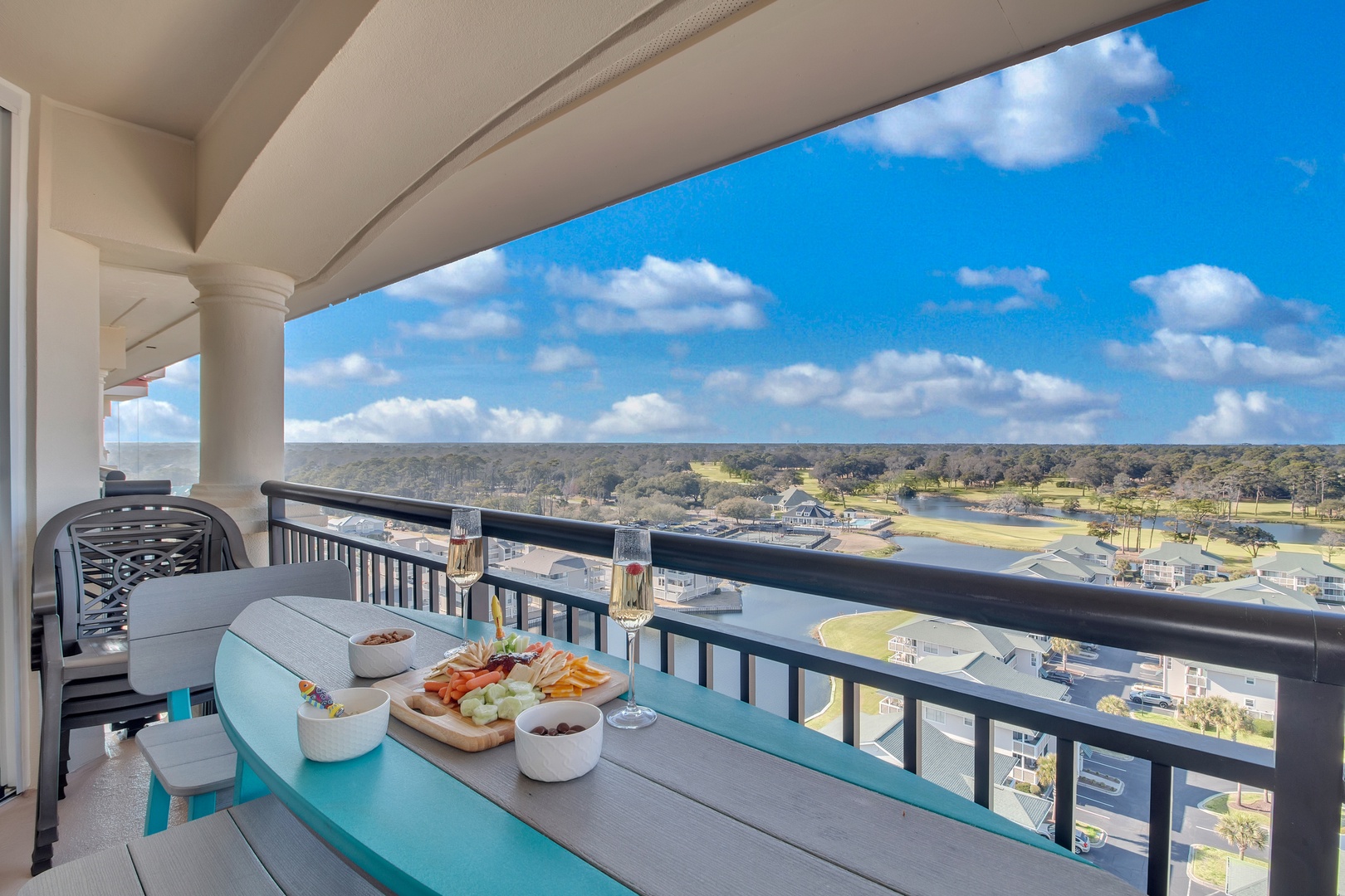 Enjoy sunset drinks and appetizers on your private balcony while taking in sweeping views of rolling hills and cityscape.