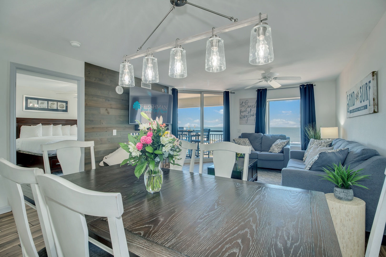 Unwind in your stylish open-plan space where coastal blues meet modern comfort, complete with stunning ocean views through floor-to-ceiling windows.