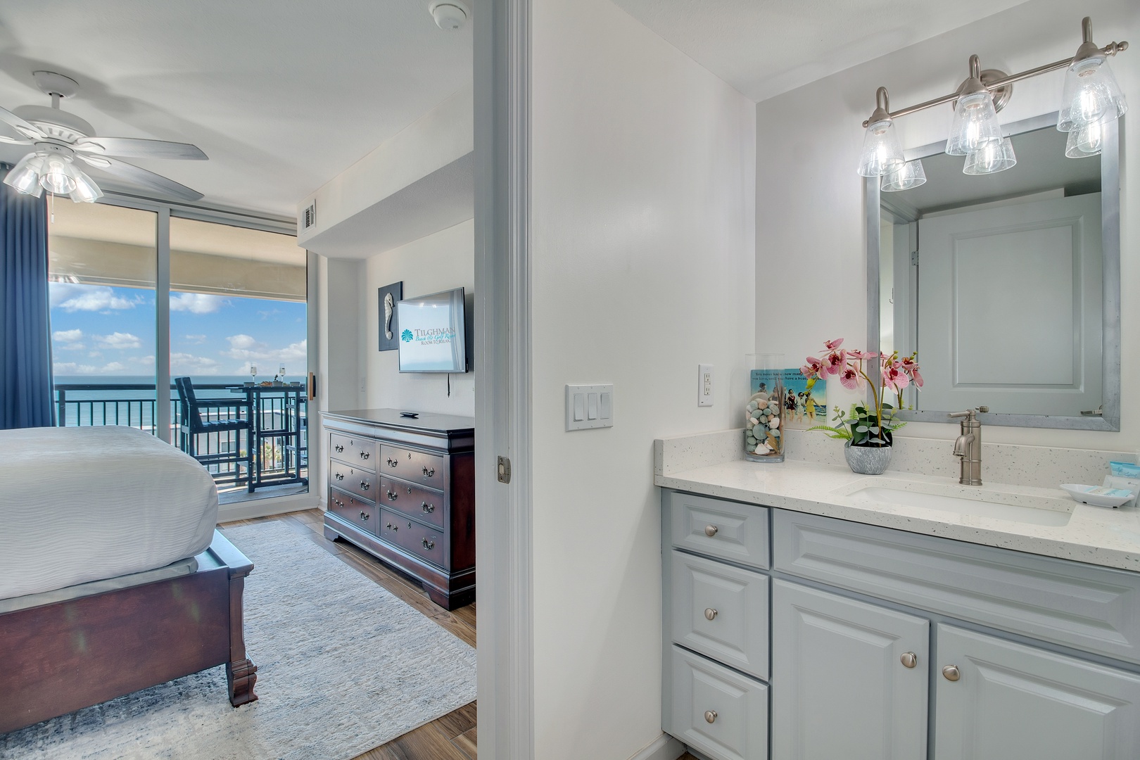Your elegant vanity area offers stunning waterfront views while you prepare for the day ahead.