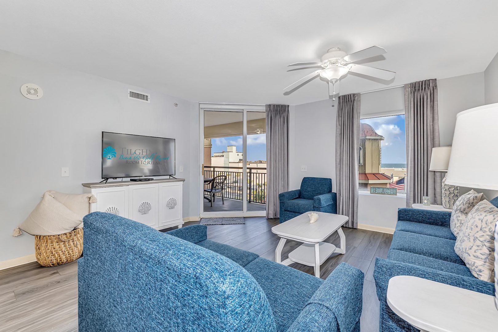 Sink into plush seating with coastal views right from your balcony. Light-filled and thoughtfully designed, this inviting living space blends comfort and style for your perfect getaway.