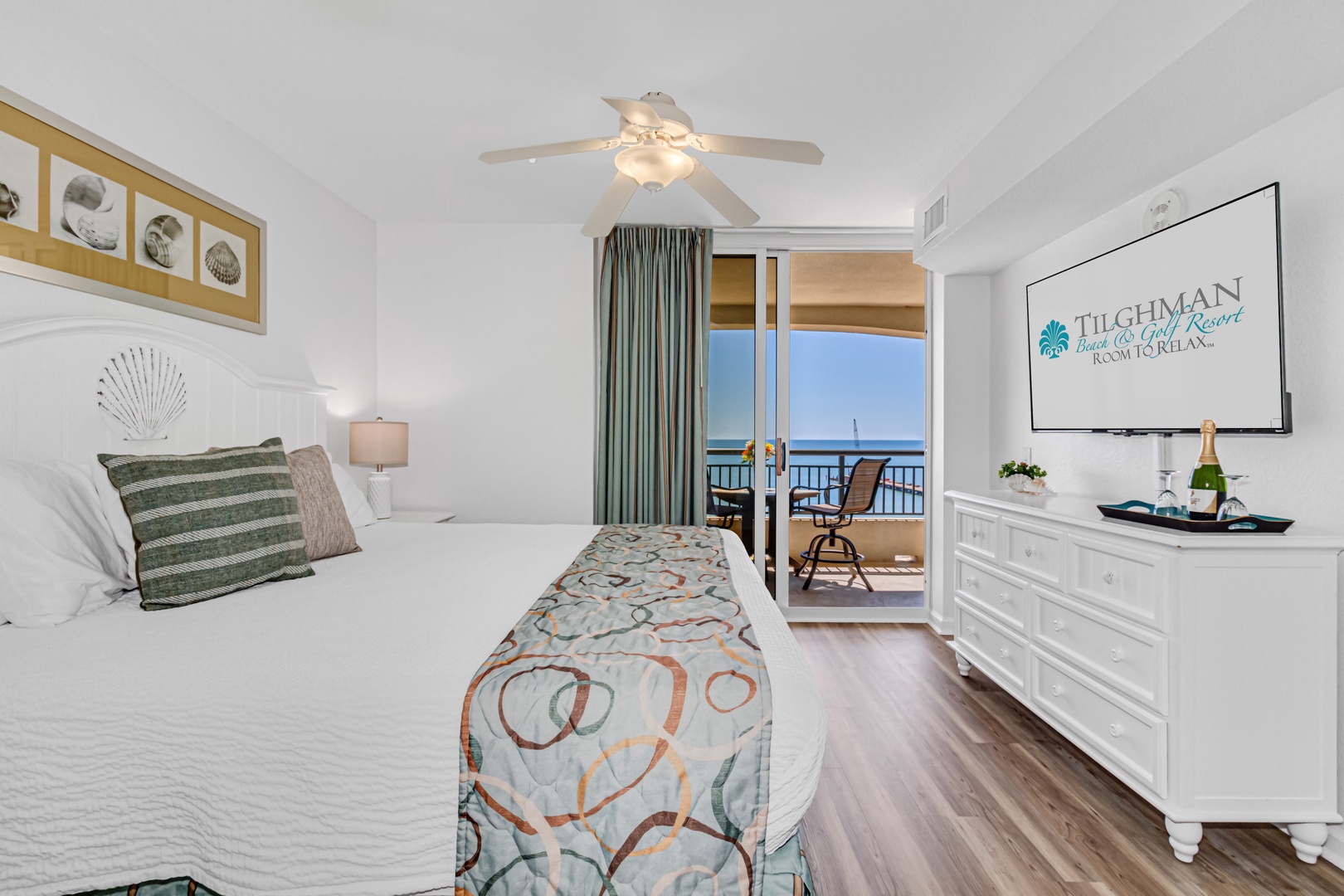 Your serene bedroom opens to a private balcony with ocean views. Relax in coastal comfort with thoughtful touches and gentle sea breezes.