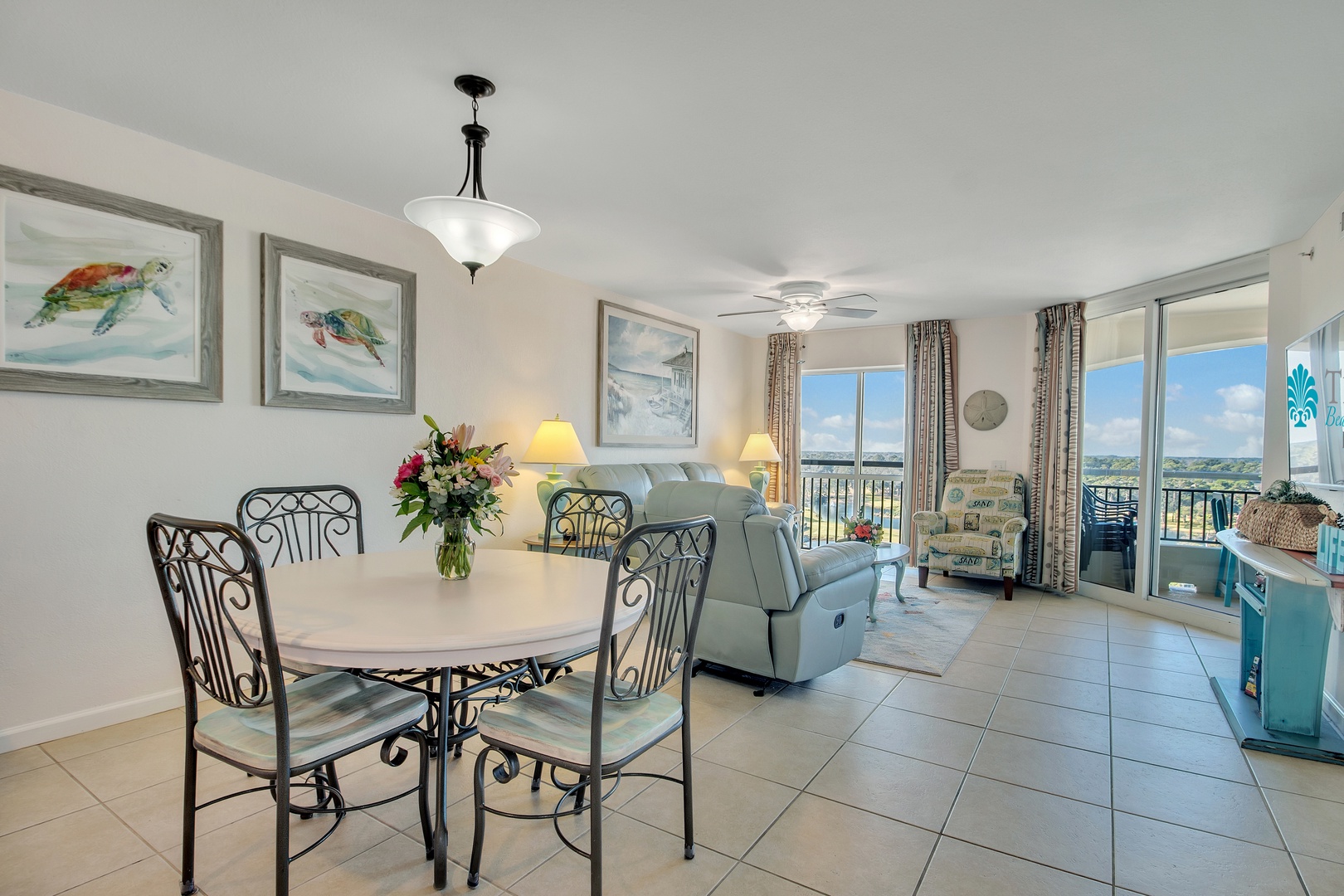 Relax in your bright coastal living space with comfortable seating, dining for four, and peaceful ocean views from your private balcony.