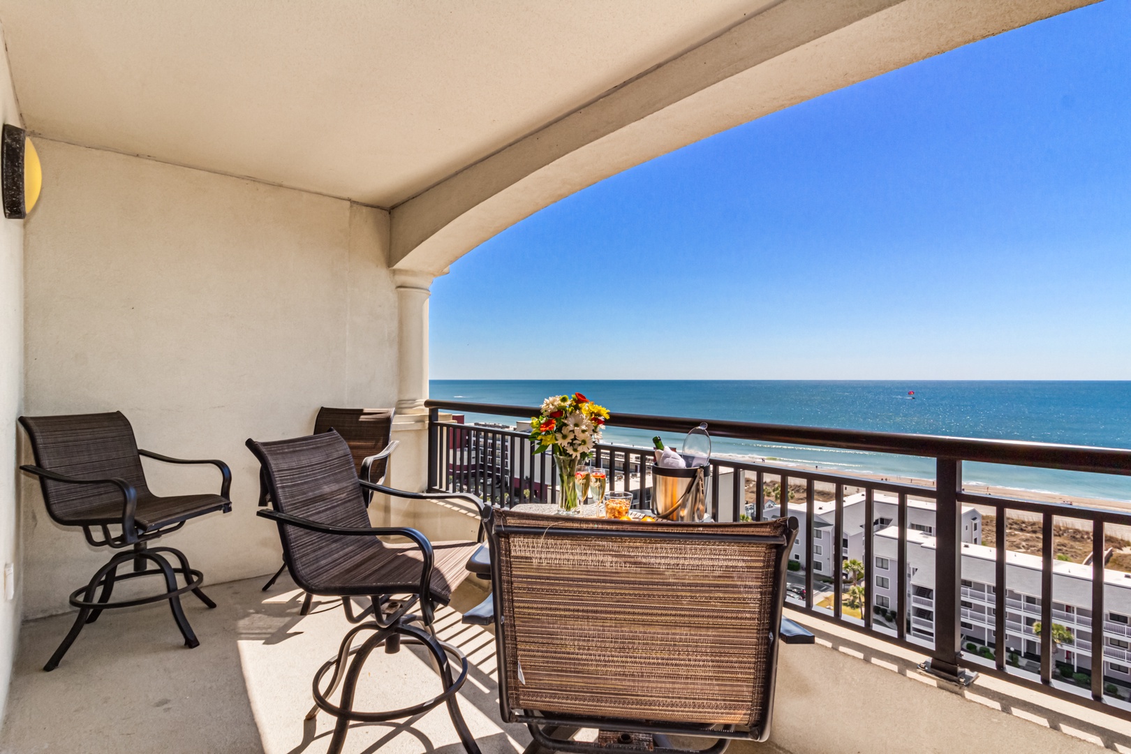Sip your morning coffee on your private oceanfront balcony with stunning sea views and comfortable seating for ultimate relaxation.
