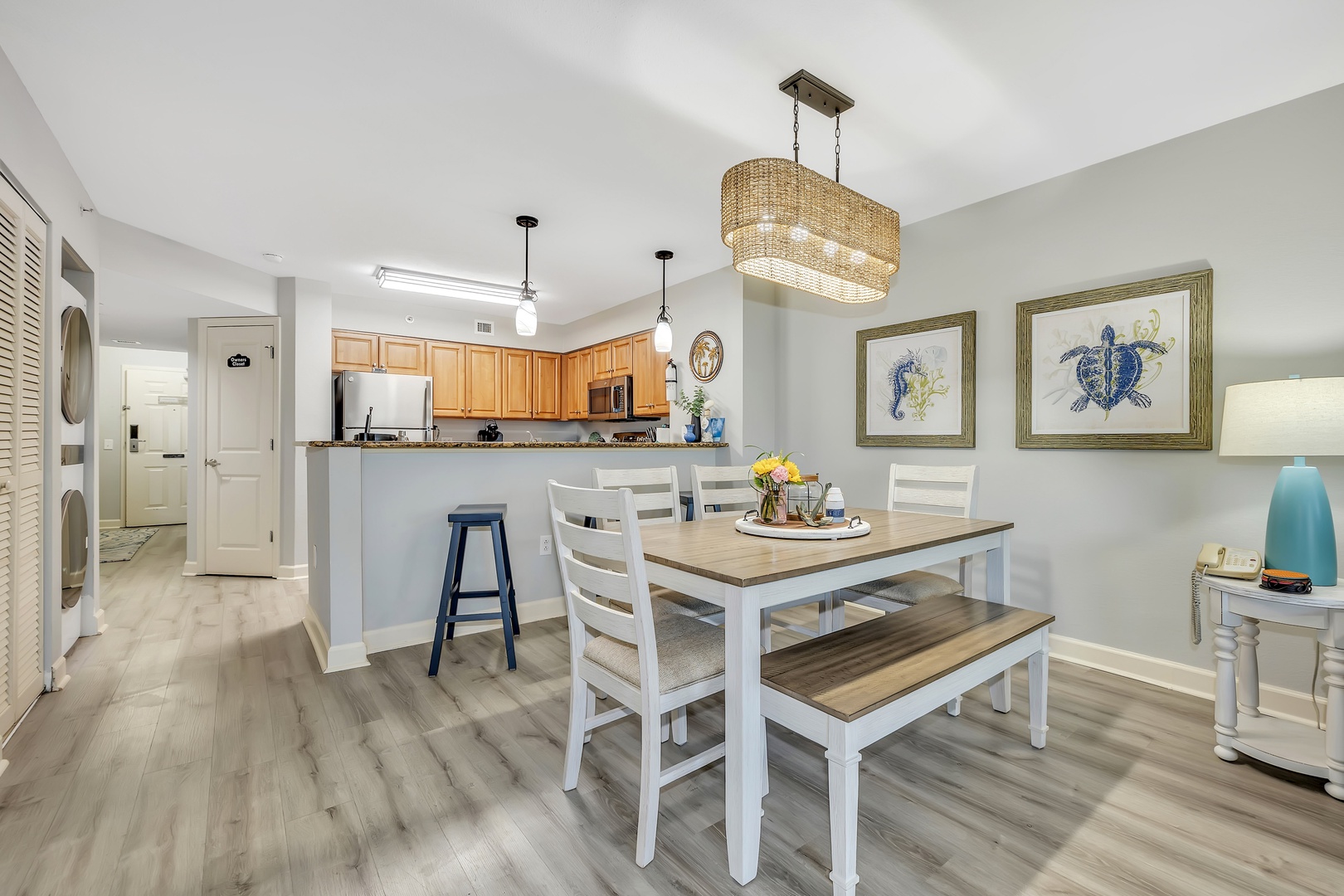 Step into your coastal-inspired dining and kitchen area, where light-filled open spaces and breezy décor invite you to gather and unwind after a day of adventure.