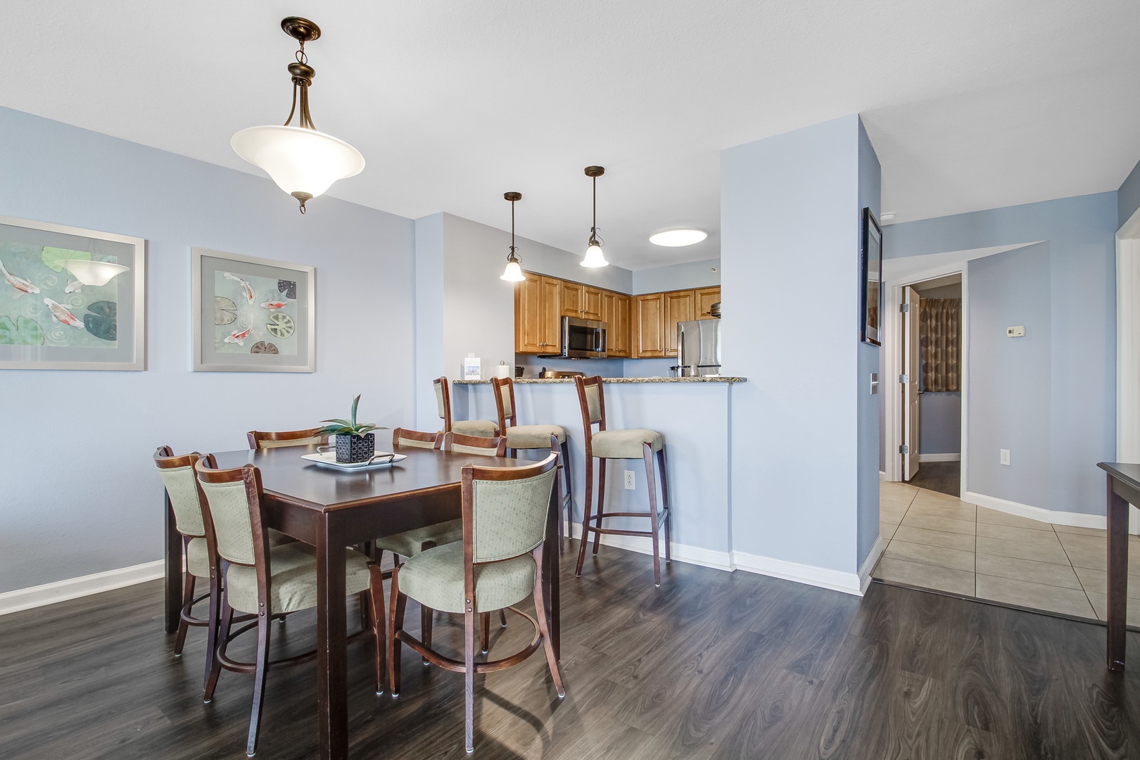 Gather around this elegant dining table for memorable meals with your loved ones in this spacious, light-filled area.